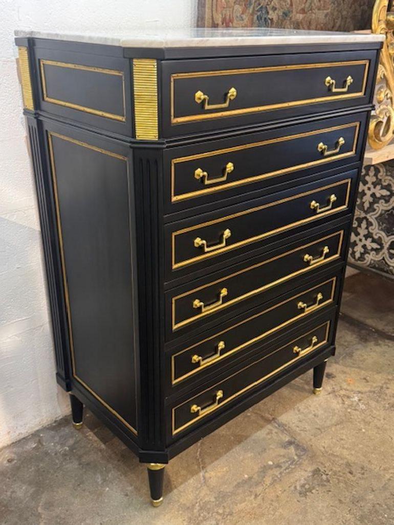 The Italian Maison Jansen Black Semanier with Brass Hardware is a stylish and sophisticated piece of furniture that adds an elegant touch to any room. The sleek black exterior with brass hardware gives off a high-end, luxurious vibe that is perfect