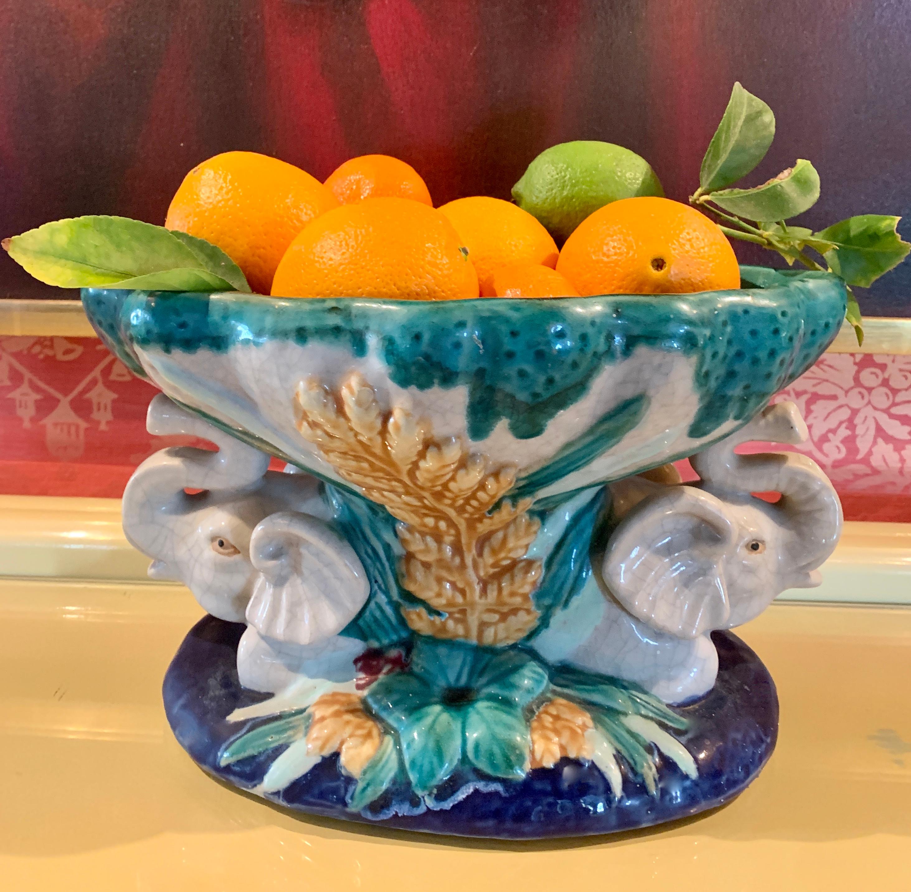 Italian Majolica bowl with elephants - A wonderful pair of elephants with their trunks up... double the good luck! Vibrant colors and details make this piece a great stand alone piece or perfect for the kitchen island or centerpiece.