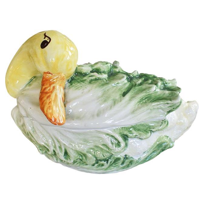 A hand-painted Italian majolica cabbageware or lettuceware bird and cauliflower tureen with lid and ladle. This petite ceramic serving dish will be a fabulous addition to any table. It features a duck in yellow with an orange beak and black eyes.