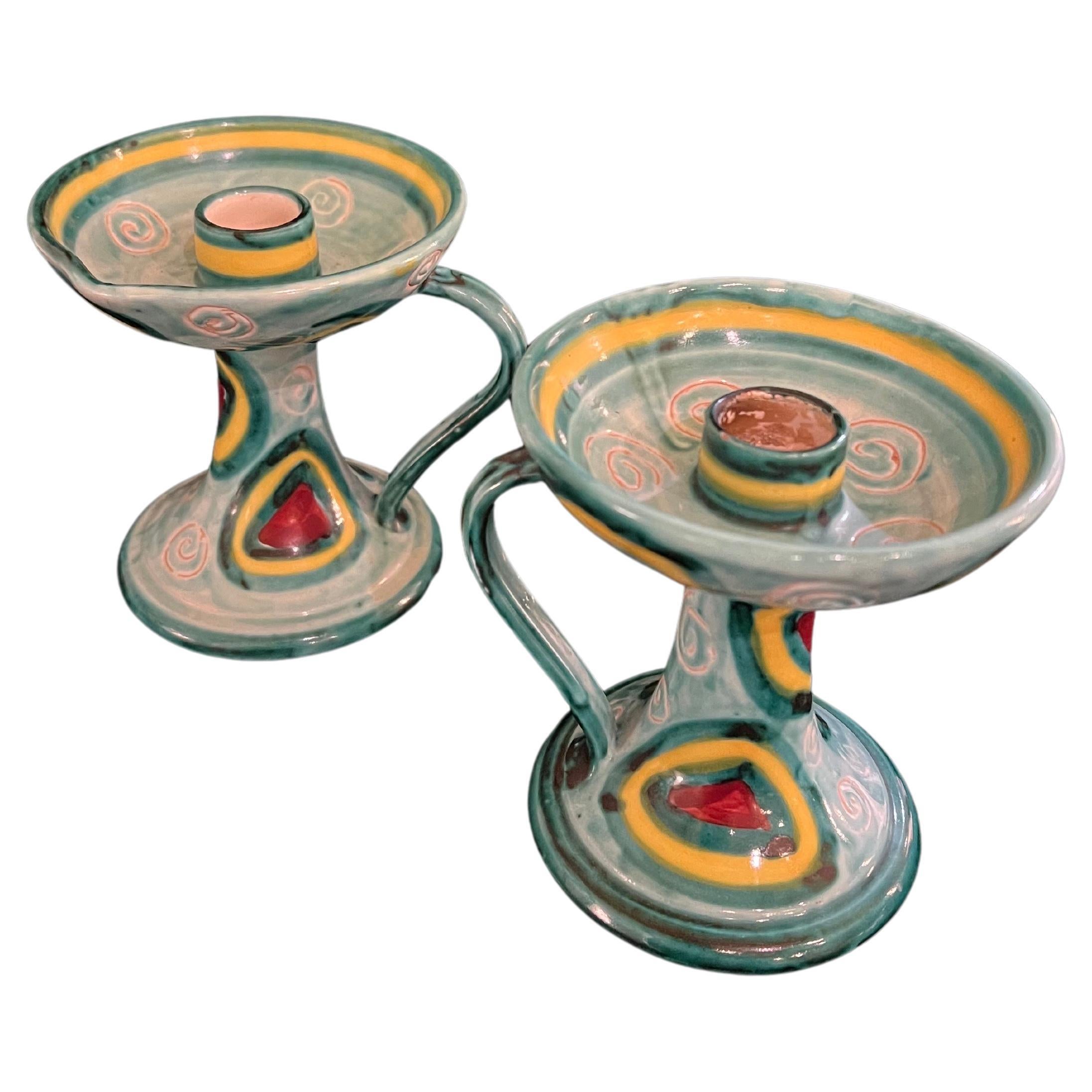 Beautiful pair of Italian ceramic candle holders in excellent condition no chips or cracks, circa 1950's stamped at the bottom PE. Beautiful colors and great design.