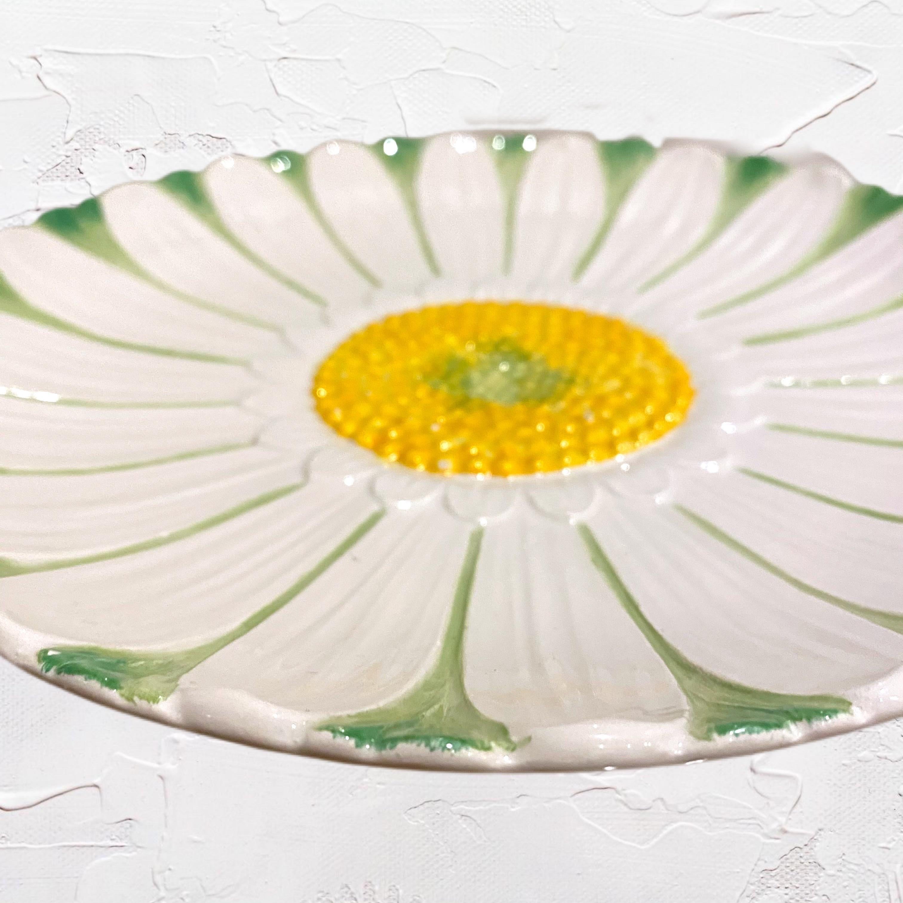 Handpainted majolica pottery daisy plates provide a charming presentation for your food or use as a catchall or hang it on the wall!  
