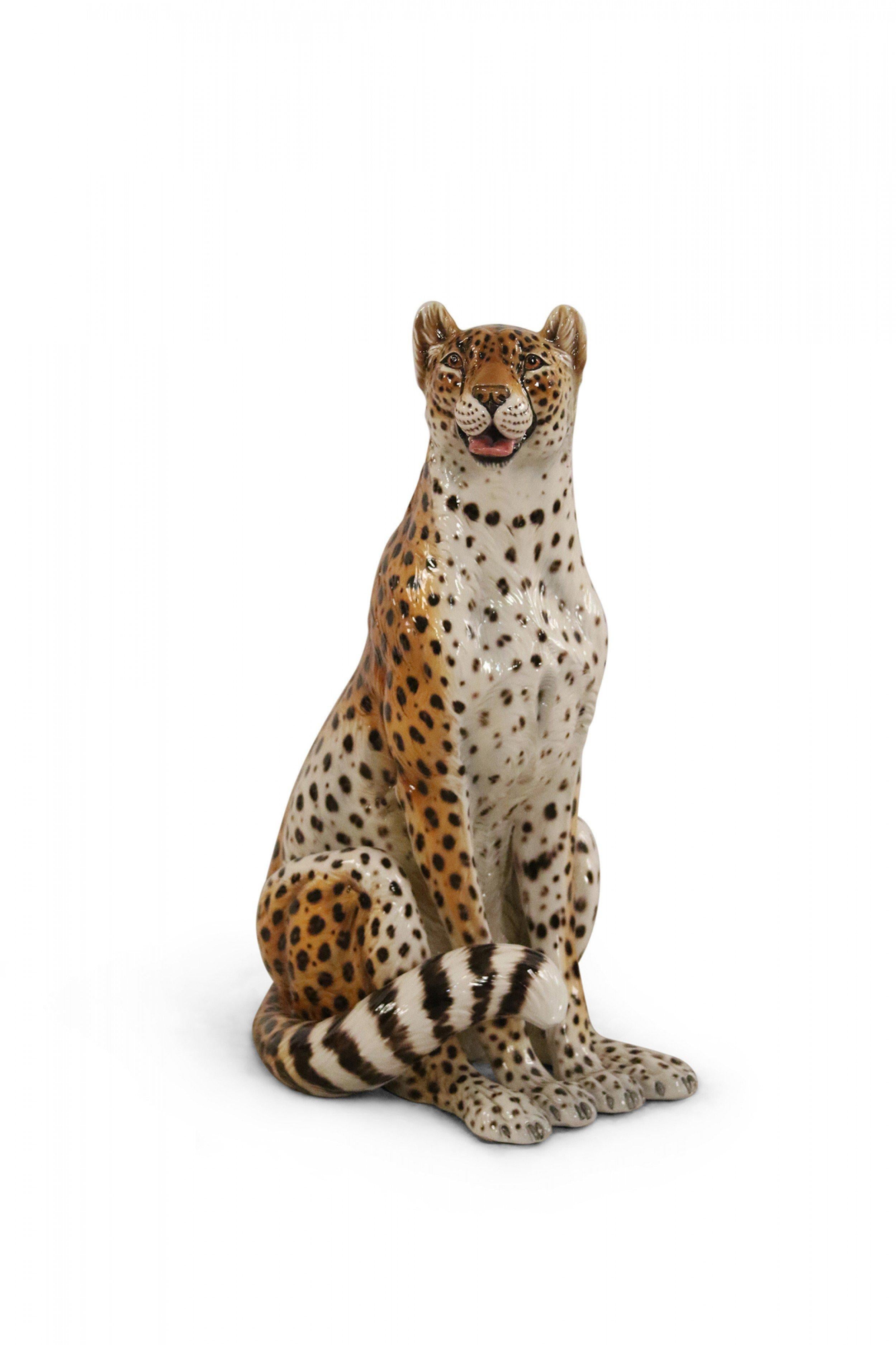 Italian glazed Majolica statue of a seated leopard with its mouth open.
 
