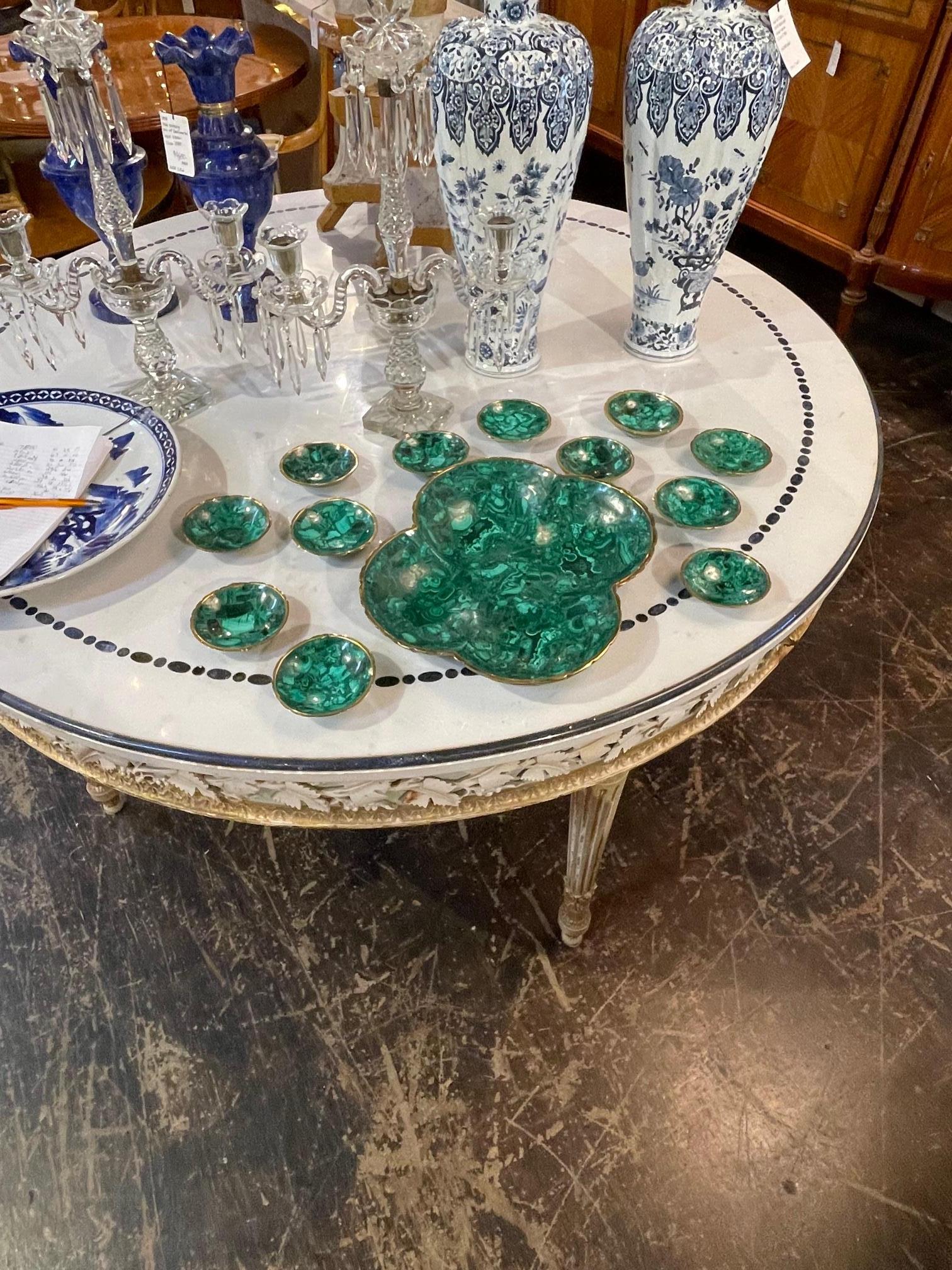 19th century Italian malachite and brass 13 piece nut dish set, circa 1880. This is a beautiful and functional set of bowls. Sure to make a statement for any party.