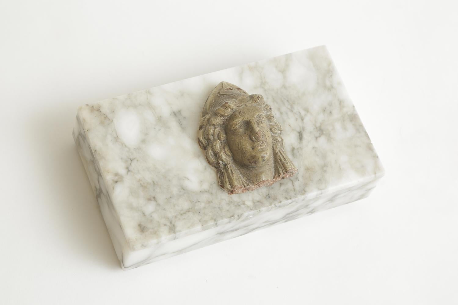 This lovely and vintage Italian marble 2 part box has a classical revival medallion head on top made out of a composition material. The marble box was cleaned and polished just recently to the best it can be now. There are no chips. This box is from