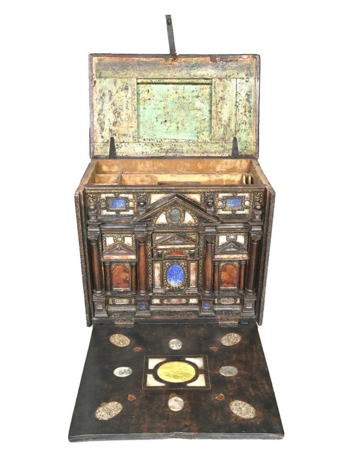 An Italian marble and mother-of-pearl mounted lacquer table cabinet, Venetian late 16th/early 17th century.
Of architectural form centred by a triangular pediment above a niche enclosing two drawers flanked by two marble columns and two further