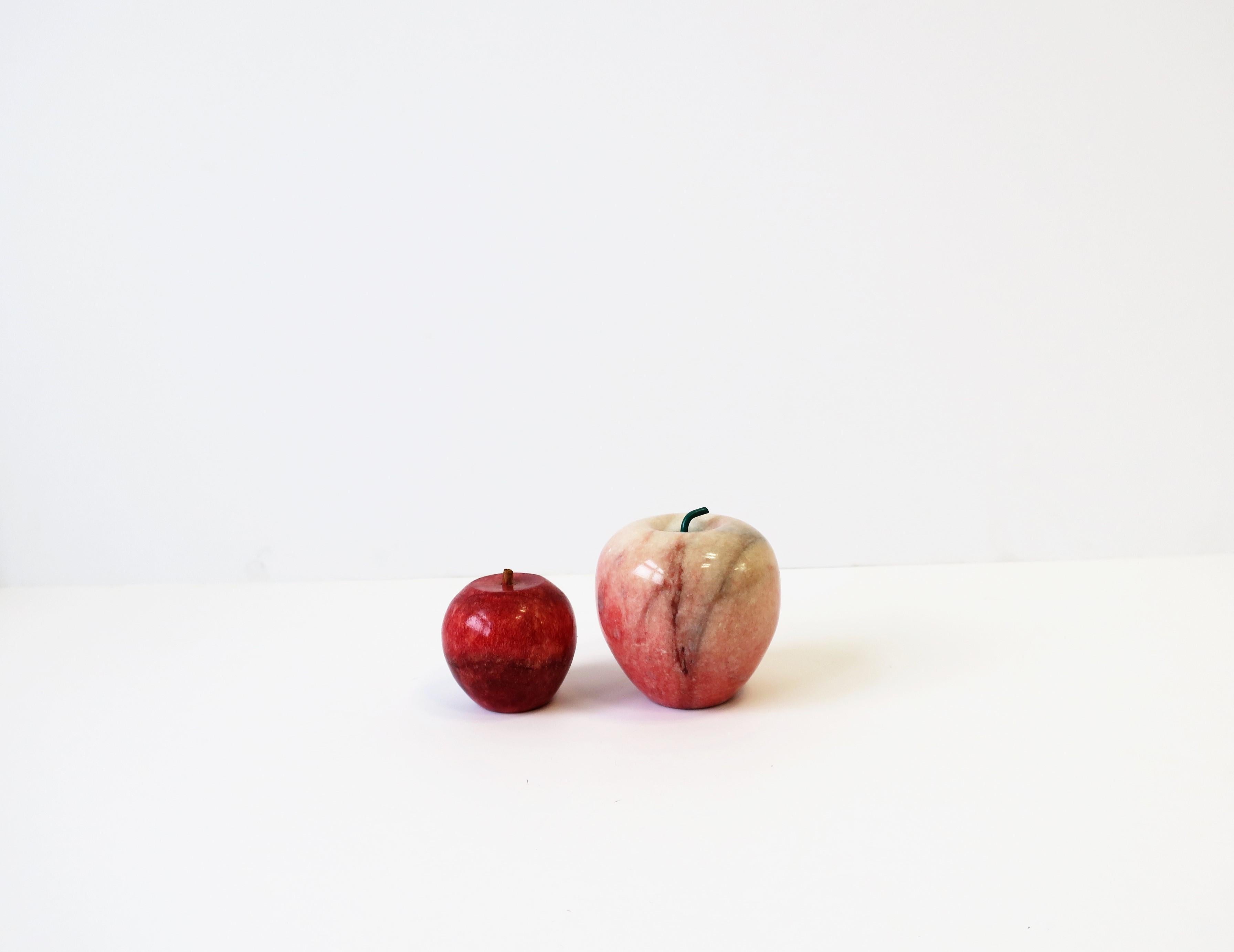 A beautiful and substantial set of Modern red, pink, and white, marble apple sculptures, carved and polished smooth, with stems, circa 20th century, Italy. Each carved and polished smooth. Beautiful marble color/hues; reds, pinks, white. Set makes