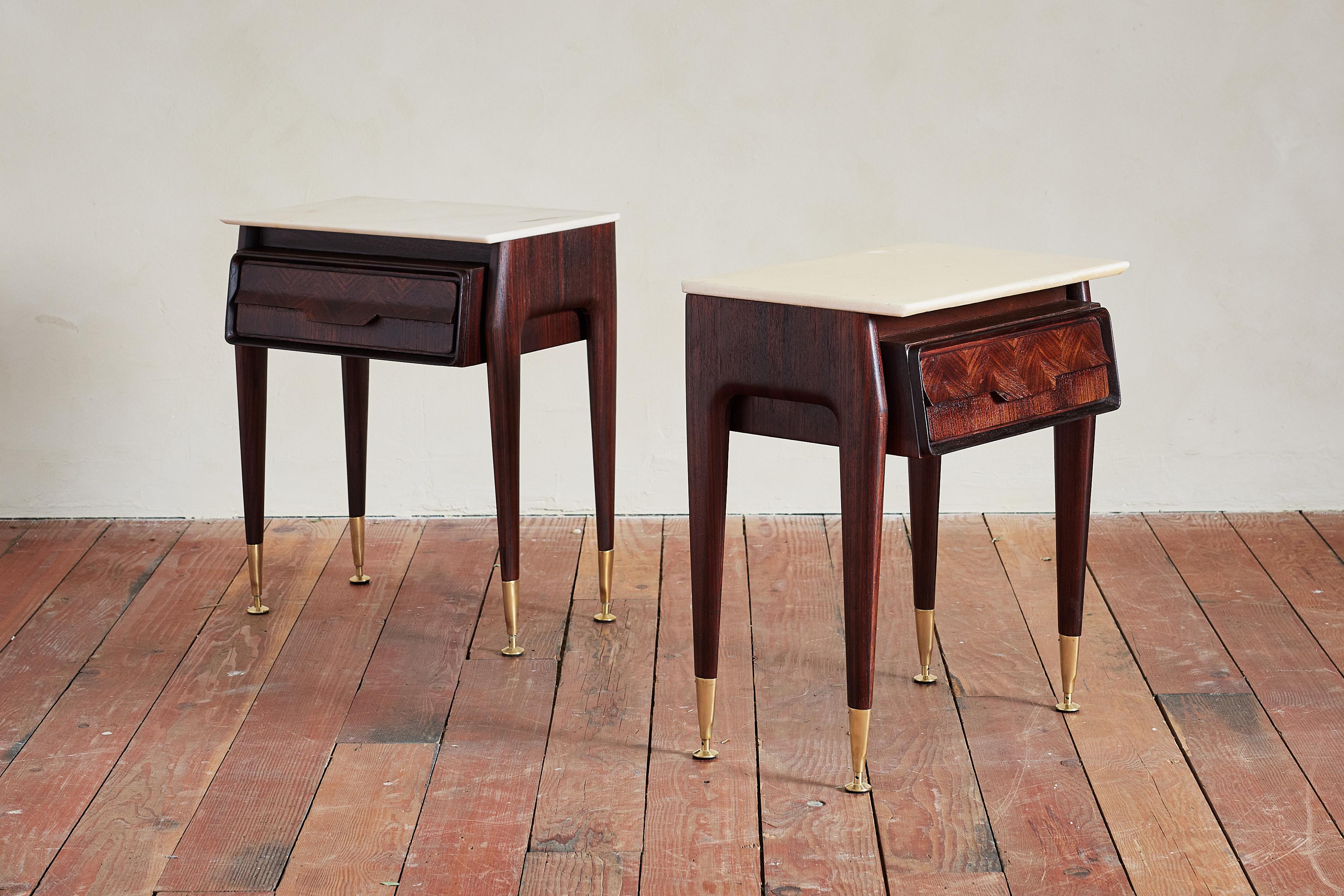 Exquisite Italian end tables with marble top and rosewood frame.

Herringbone patterned drawer fronts with handles built into the pattern.

Rosewood tapered legs with brass feet.

Wonderful piece - matching chest of drawers available. 