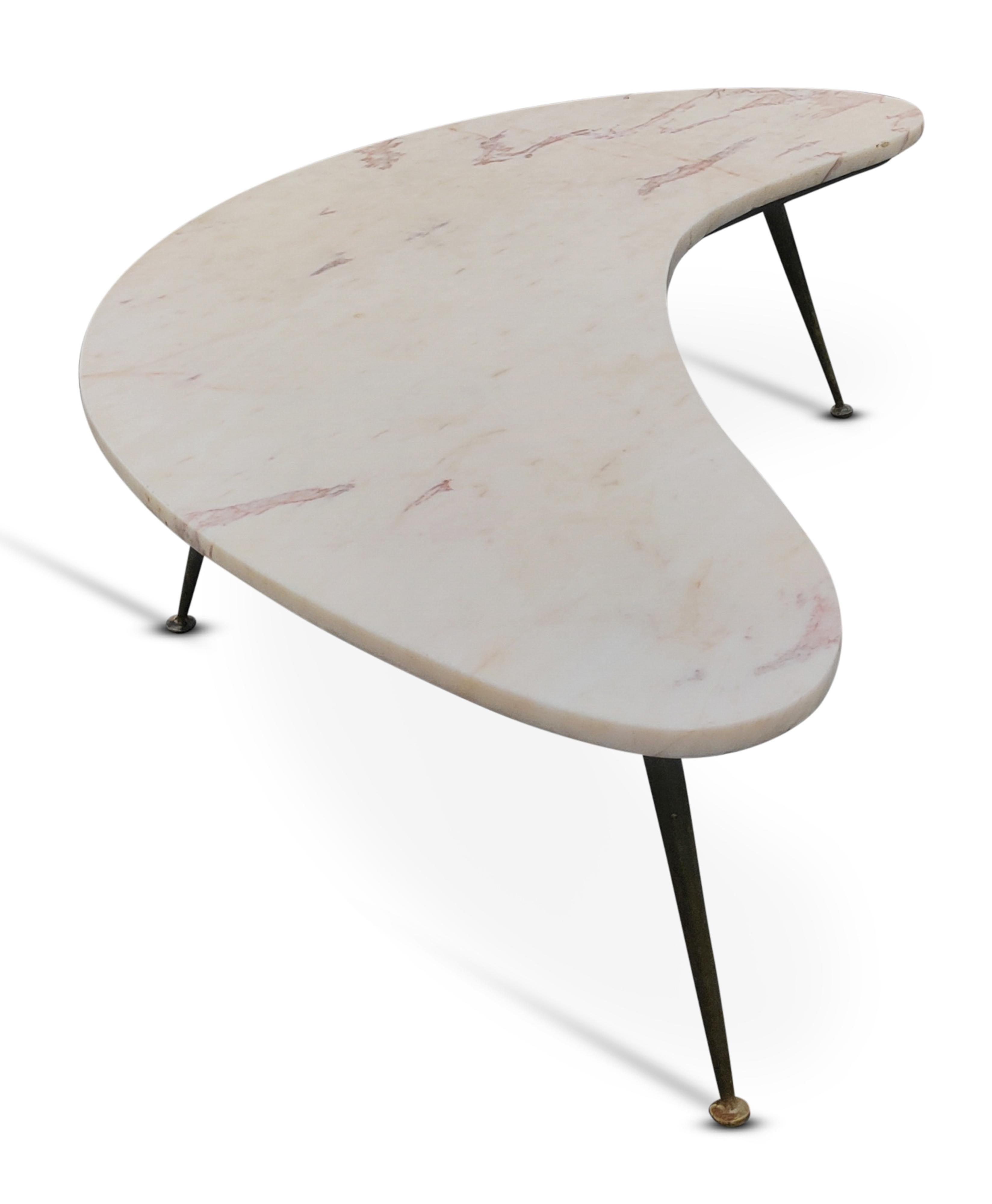 For your consideration, an authentic and completely original Italian coffee table, circa 1950s, in the Style of Gio Ponti. Shaped like a crescent, or boomerang, with a 21.75 inch width at its center, it has an off-white, almost pink, color streaked