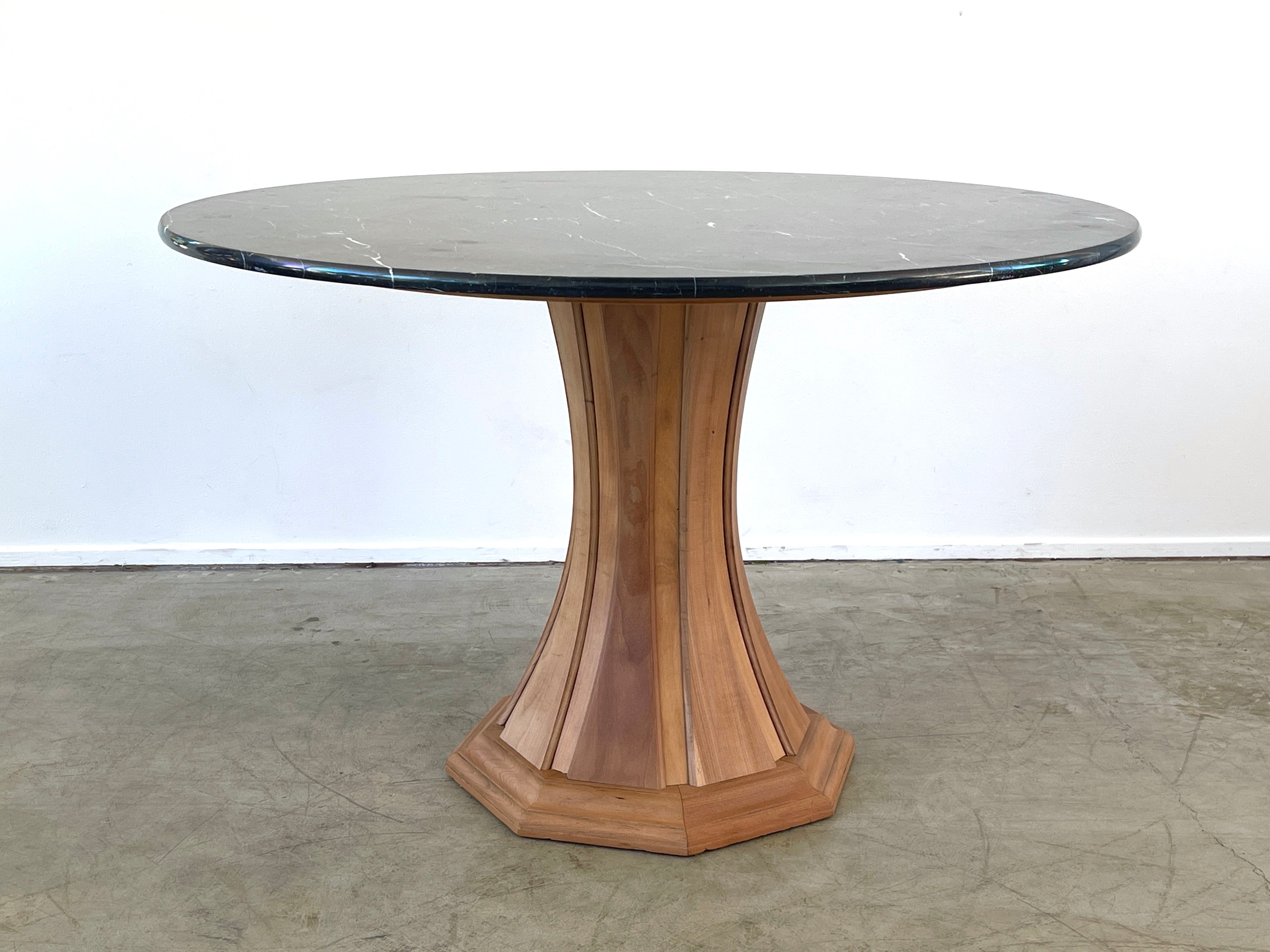 Italian marble center table with beautiful black marble and faceted wood pedestal base.
In the style of Paolo Buffa - 
Italy, circa 1960's