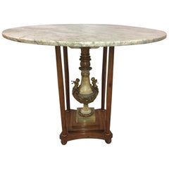 Mesa de centro de mármol italiano con pedestal de ónice y querubines de bronce