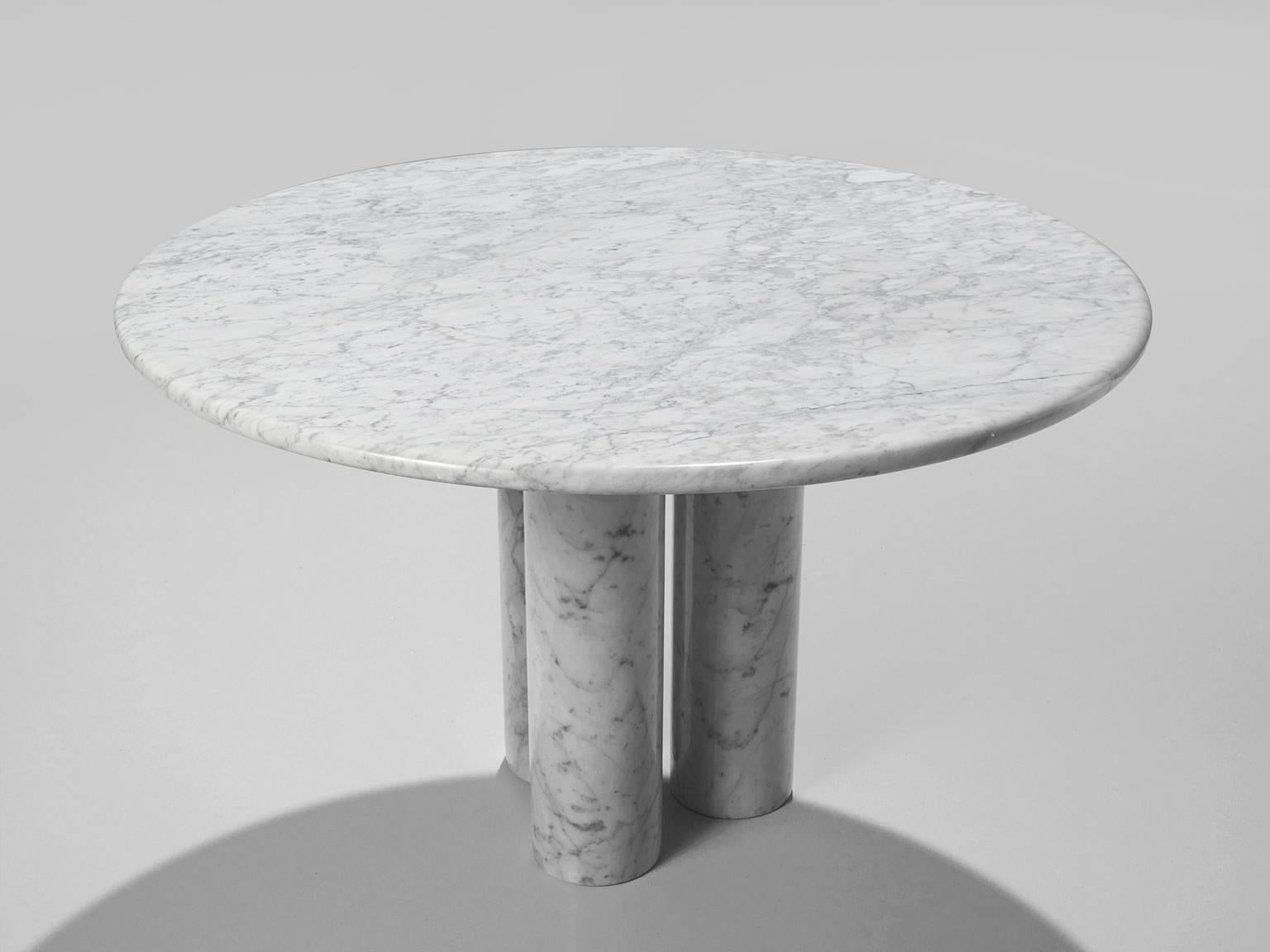 Breakfast table, marble, Italy, 1970s. 

This architectural table is a skillful example of postmodern design. The circular table features no joints or clamps and is architectural in its structure. The table rests on the three column-like legs. The