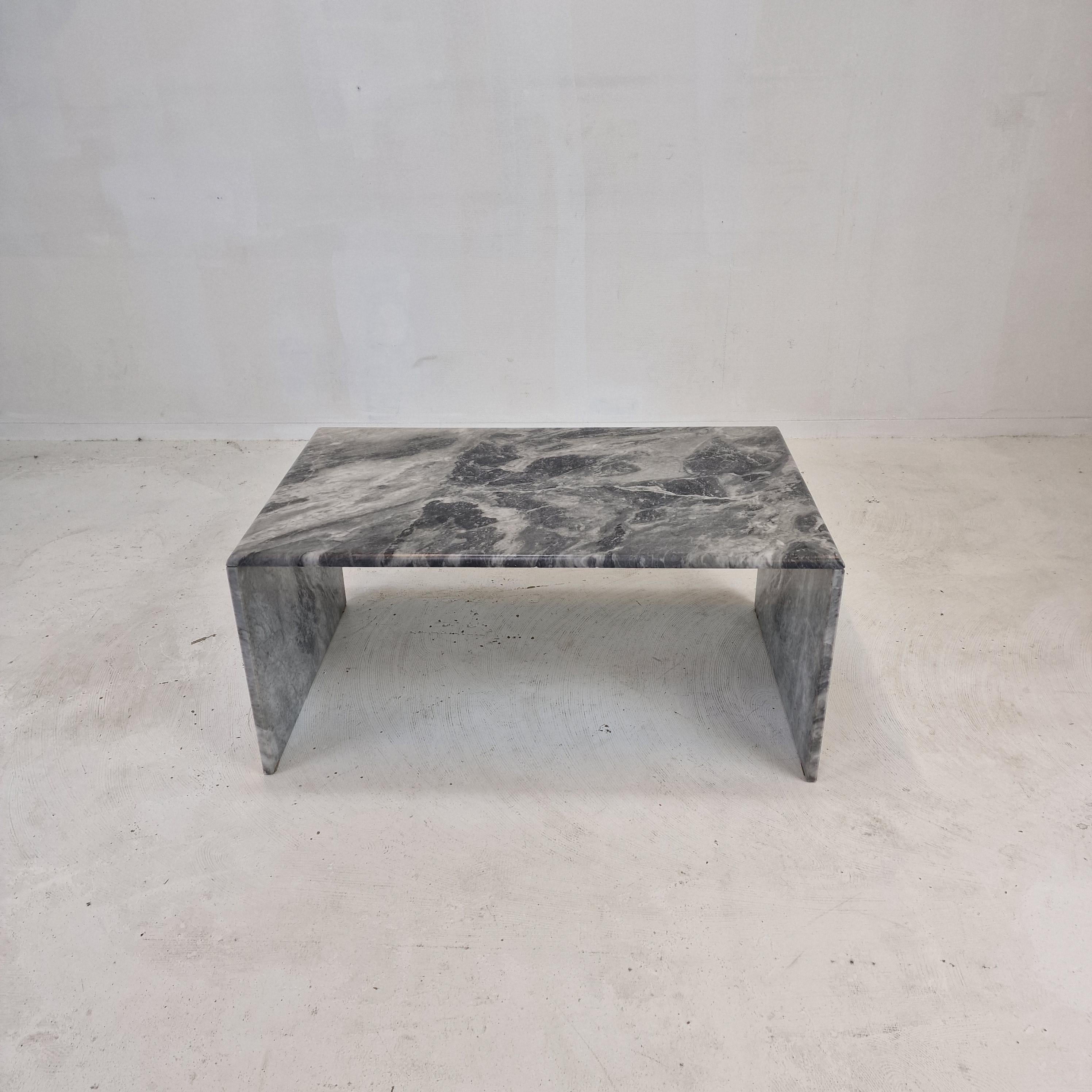 Very nice Italian coffee or side table handcrafted out of marble, 1970s.

The rectangle top and the two feet are made of very beautiful marble.
The fabulous marble features a very nice pattern of different colors.

It has the normal traces of