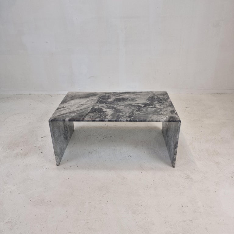 Very nice Italian coffee or side table handcrafted out of marble, 1970s.

The rectangle top and the two feet are made of very beautiful marble.
The fabulous marble features a very nice pattern of different colors.

It has the normal traces of