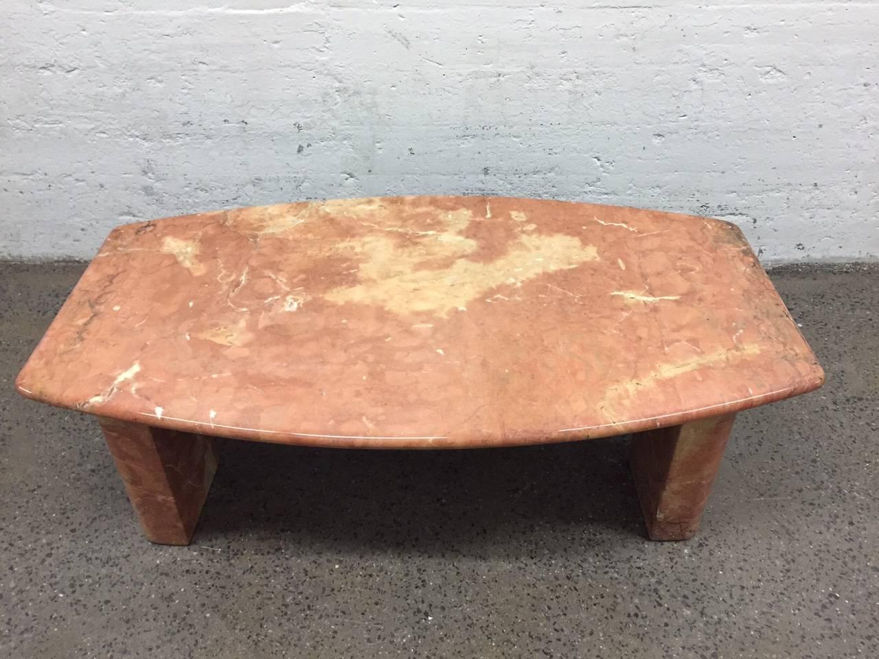 Italian marble coffee table. Solid marble top which sit on four solid marble posts. Style of Angelo Mangiarotti.
 