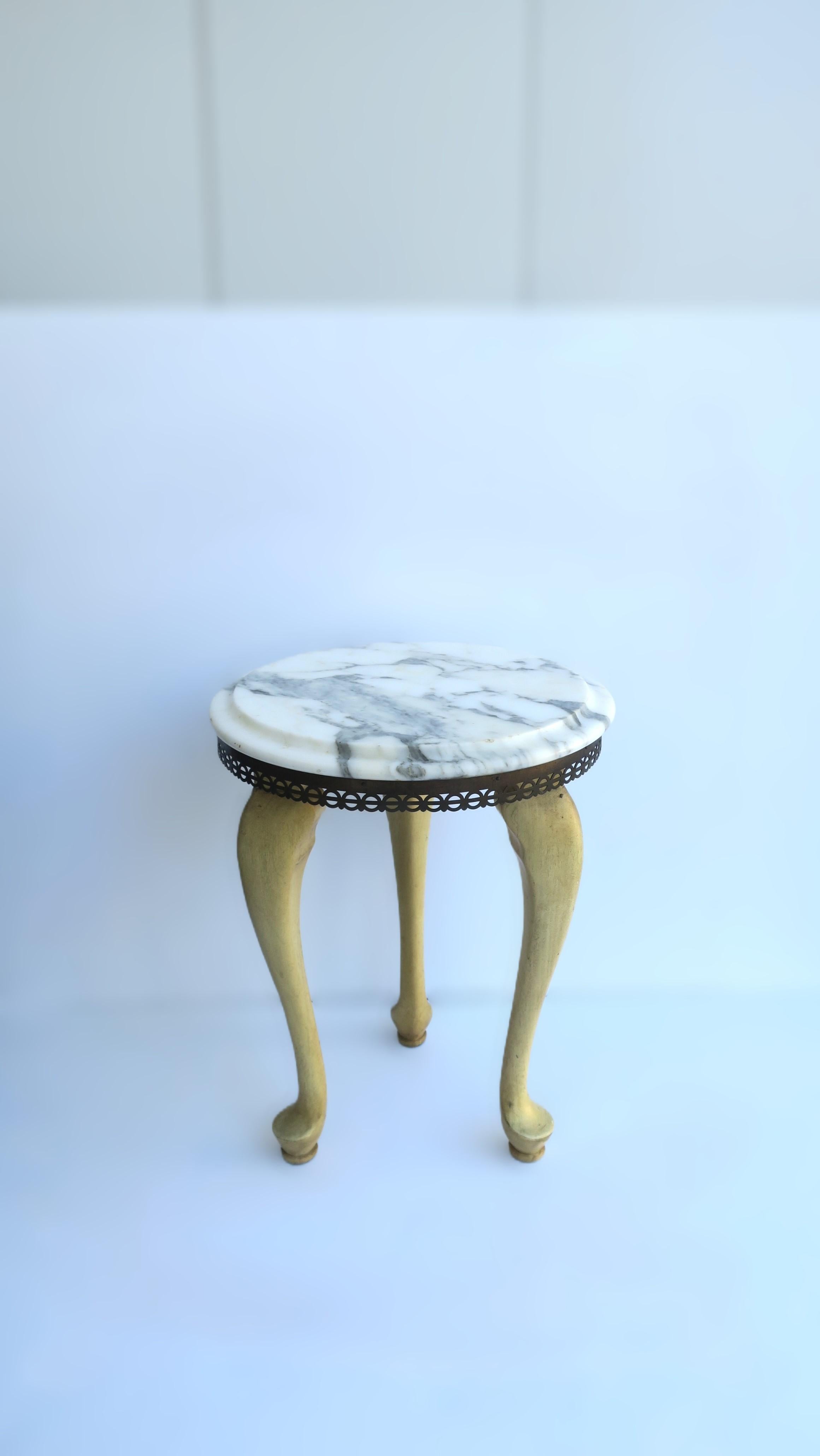 **One of two available, each sold separately, as per listing.

An Italian marble and wood side or drinks table, in the Rococo style, circa early to mid-20th century, Italy. Table has a blonde wood base with a cabriole leg and pad feet, finished with