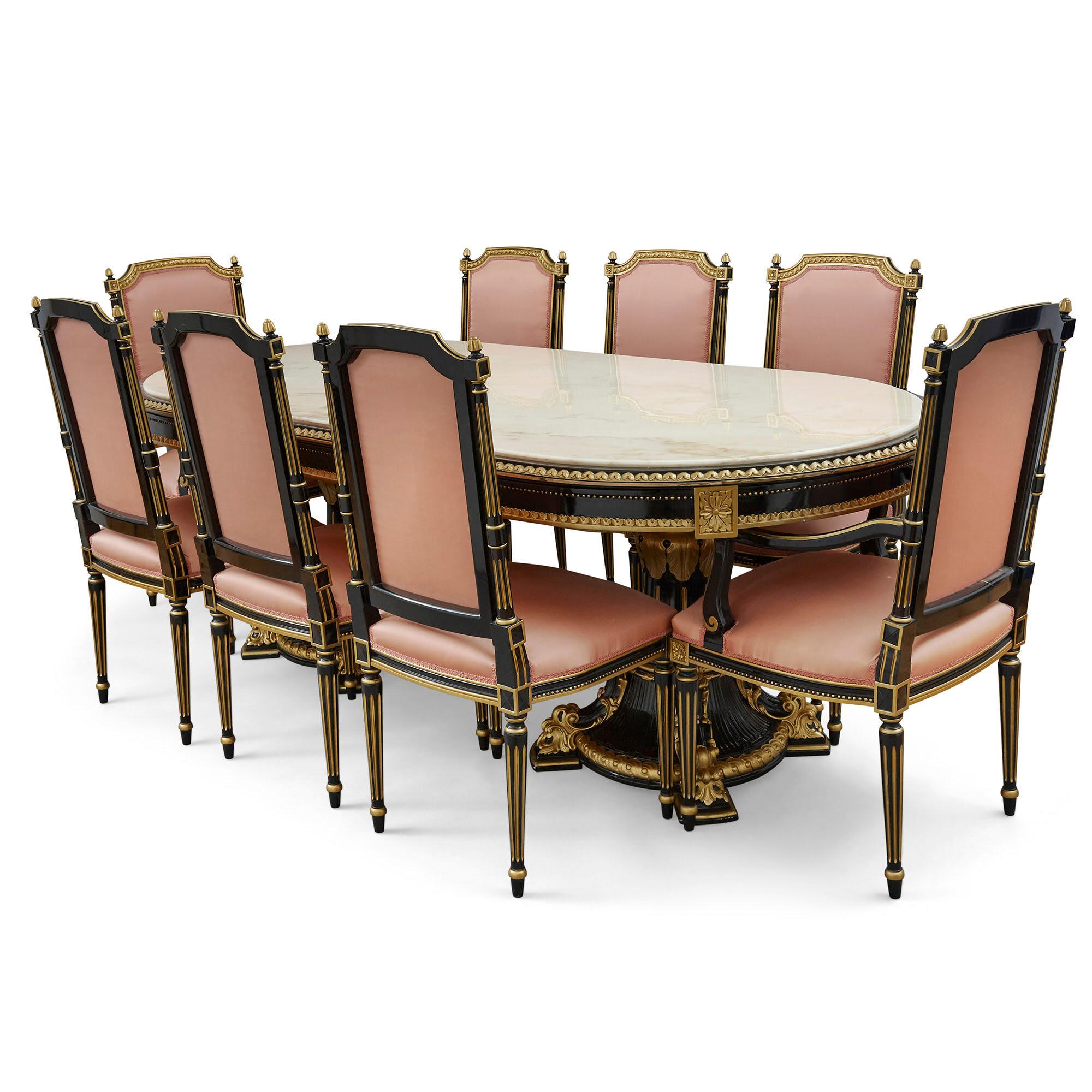 Italian marble, ebonised and gilt wood dining table
Italian, 20th century
Measures: Height 78cm, width 270cm, depth 110cm

This large and elegant dining table is designed in the neoclassical style. The table features a beautiful marble top with