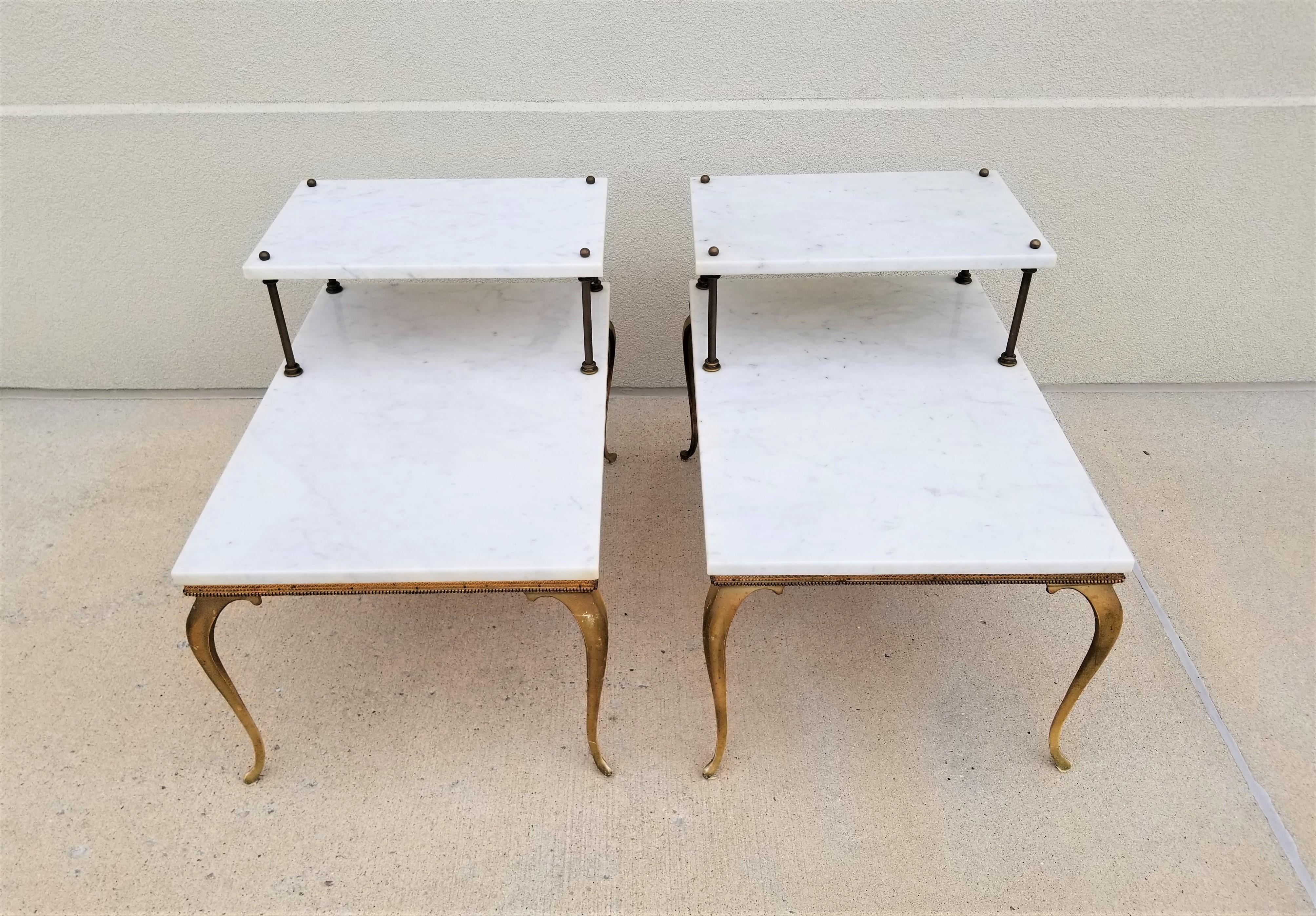 Italian Marble midcentury 1950s 1960s Tiered End Tables. Carrera Marble. Brass Hardware. Gilded Iron legs with French Provincial design. Both Marked Made in Italy. 

Measurement:
Height to top of Brass Ball: 24.0 inches
Height to top of second