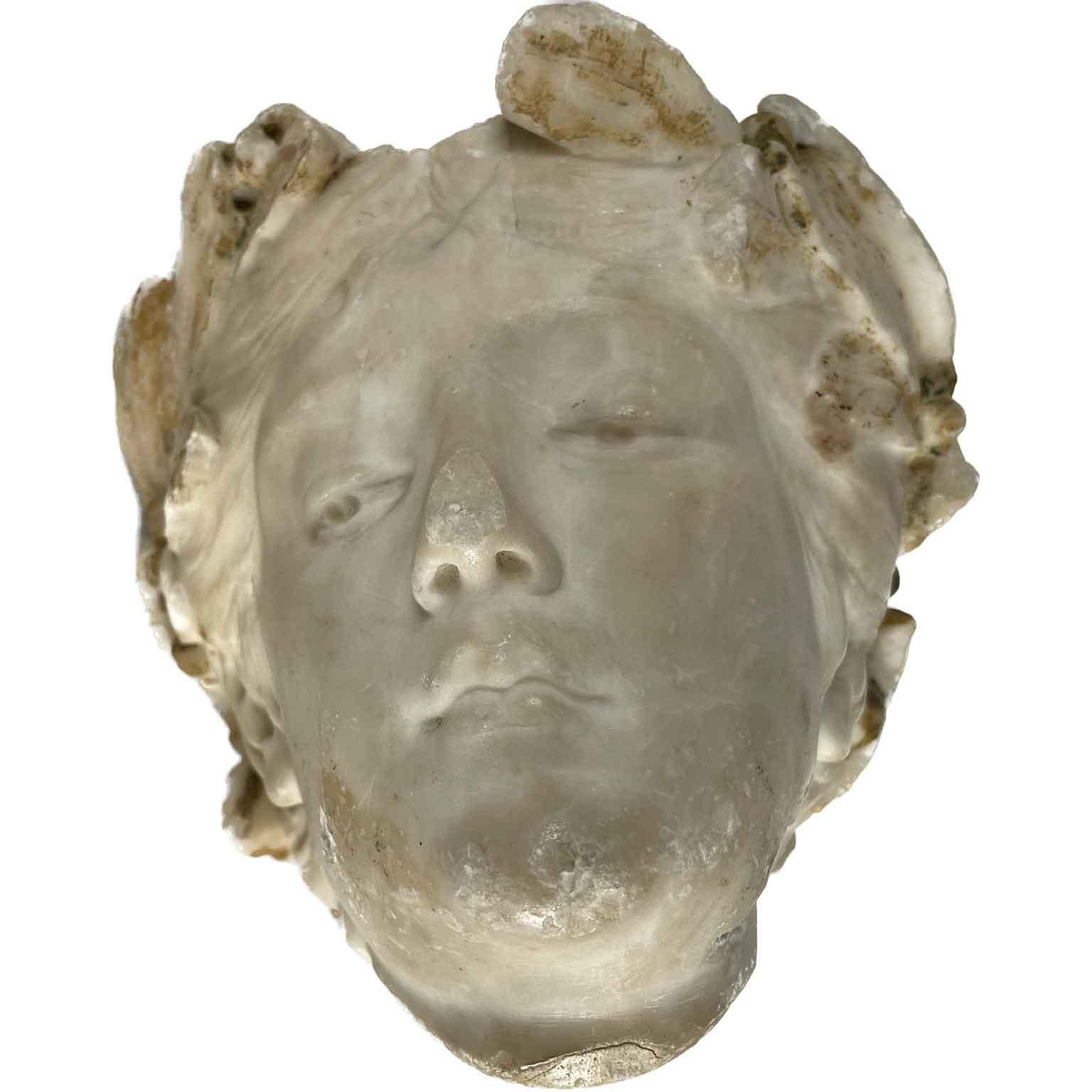 Early 20th Century Italian Alabaster Female Head Garden Statue Fragment of Classical Roman Greek Style. Carved alabaster head of  a woman,  an ideal female character, probably a deity,  the face of a girl with long hair gathered and tied on the top