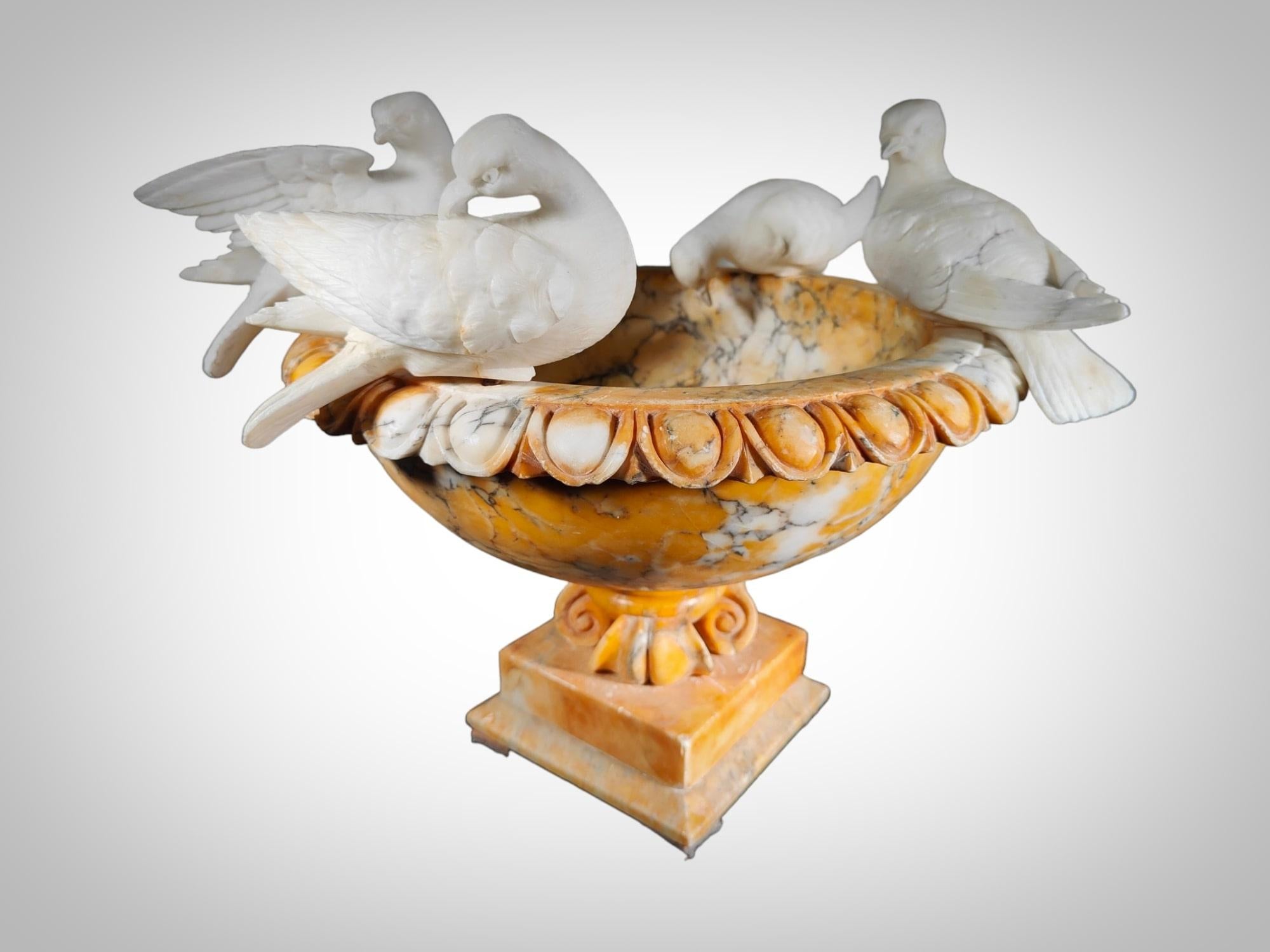 Embark on a journey through time with this majestic Italian marble fountain or centerpiece from the 19th century. Every meticulous detail speaks of the art and craftsmanship of an era that has endured in its elegance. On the rim, four removable
