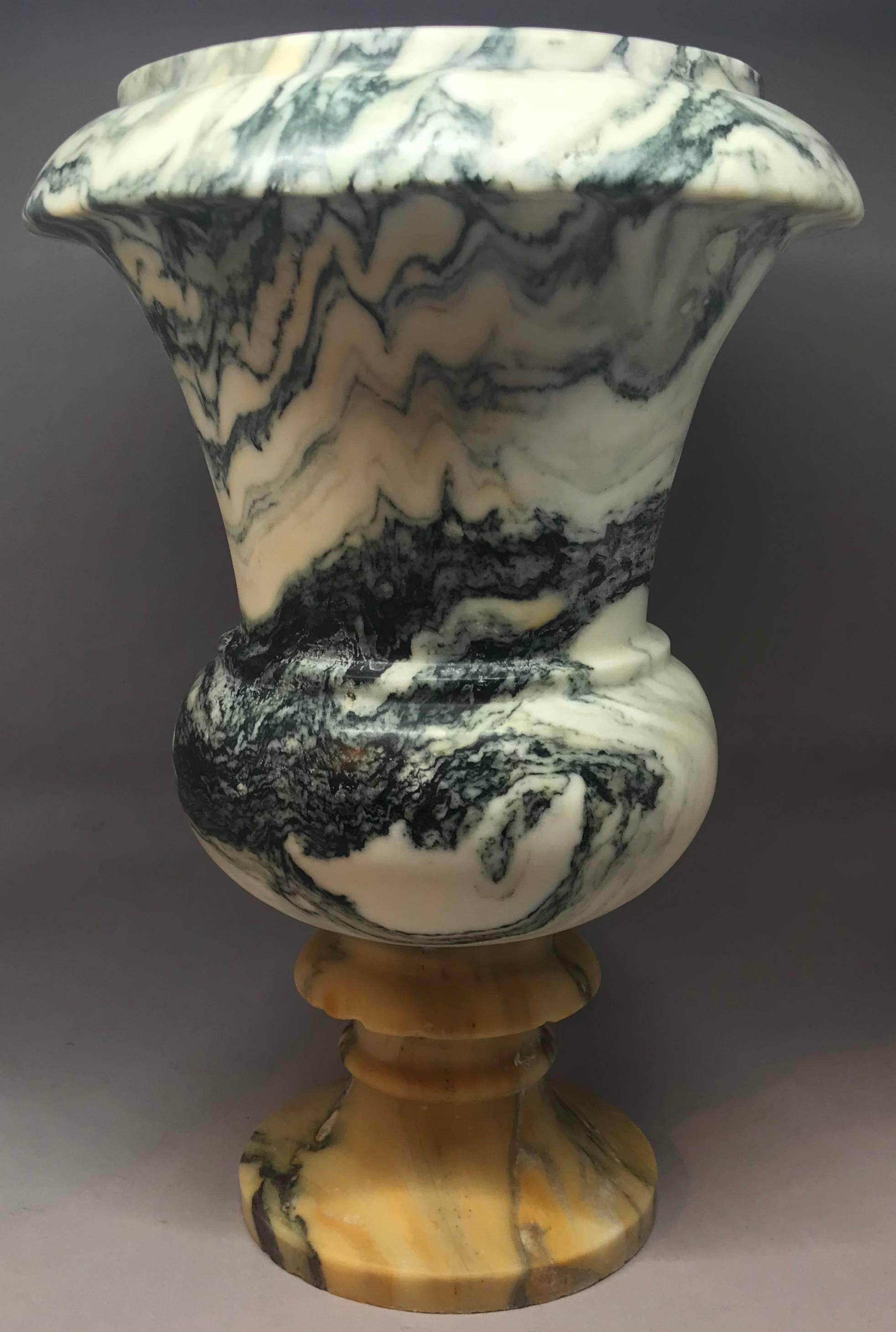 Italian marble Medici style vase Antique richly veined marble vase in the Medici style with cipollino carved top and a giallo di Siena base, Italy, circa 1925.
Dimensions: 9