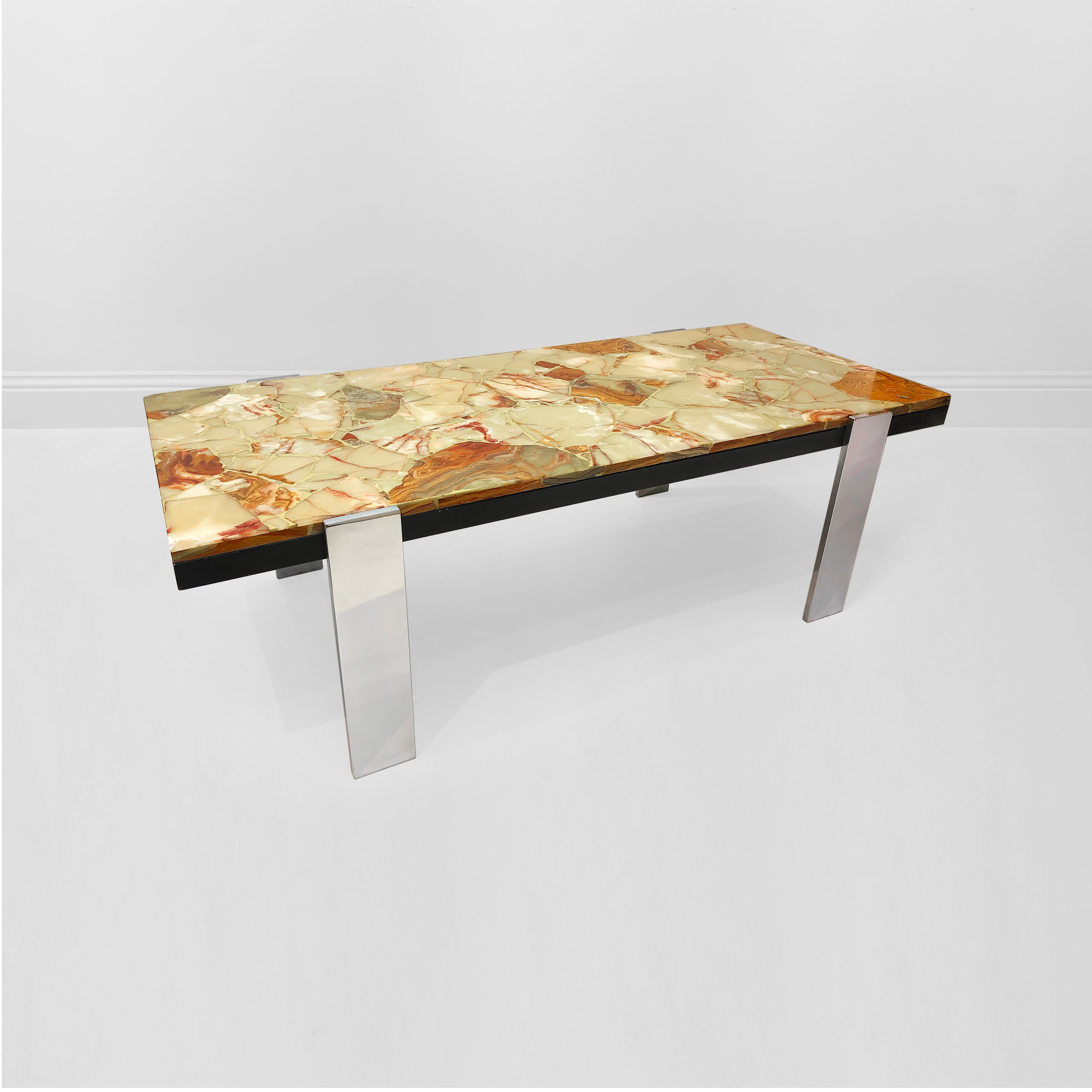 This gorgeous Mid-Century Modern coffee table originated in Italy in the 1970s, and was imported to the UK in the early 2010s. is a stunning piece of furniture that combines durability and elegance in equal measure. The table features sleek, steel