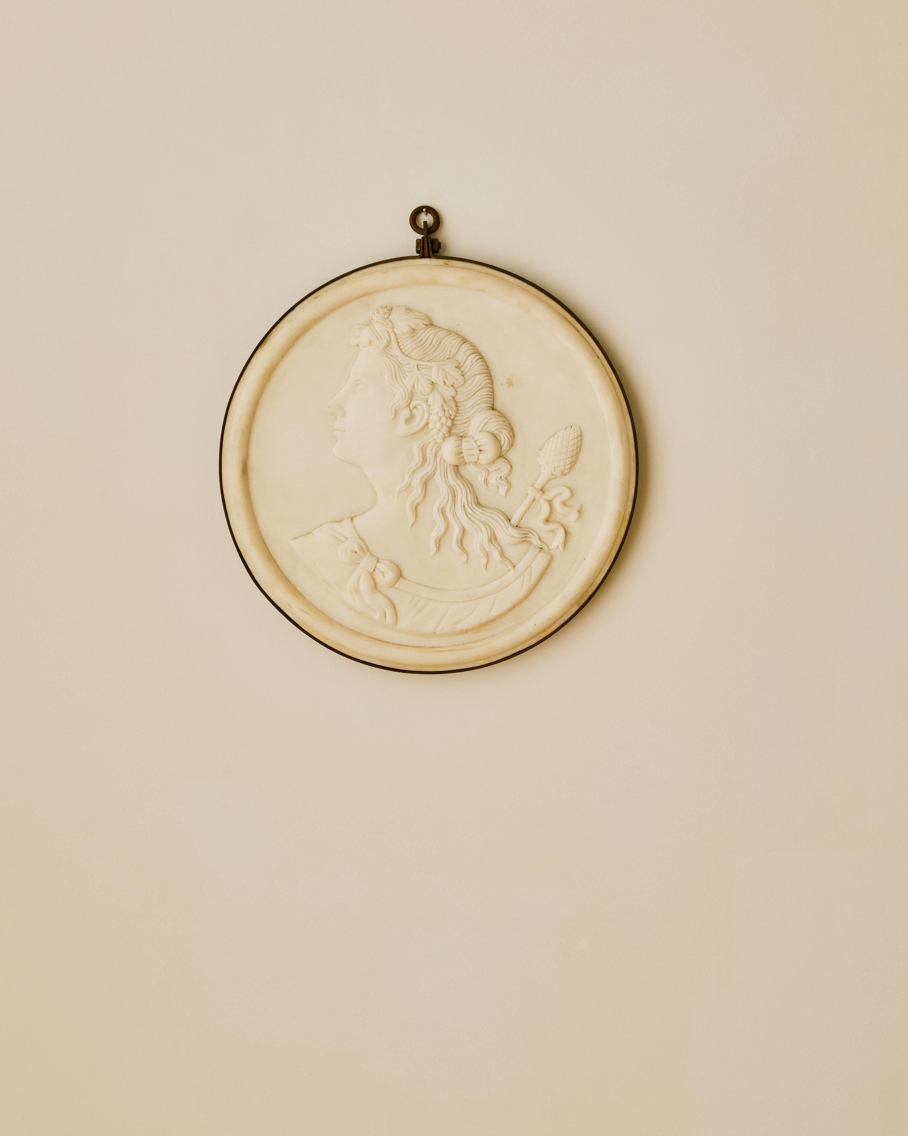 Italian marble relief round plaque mounted in iron.