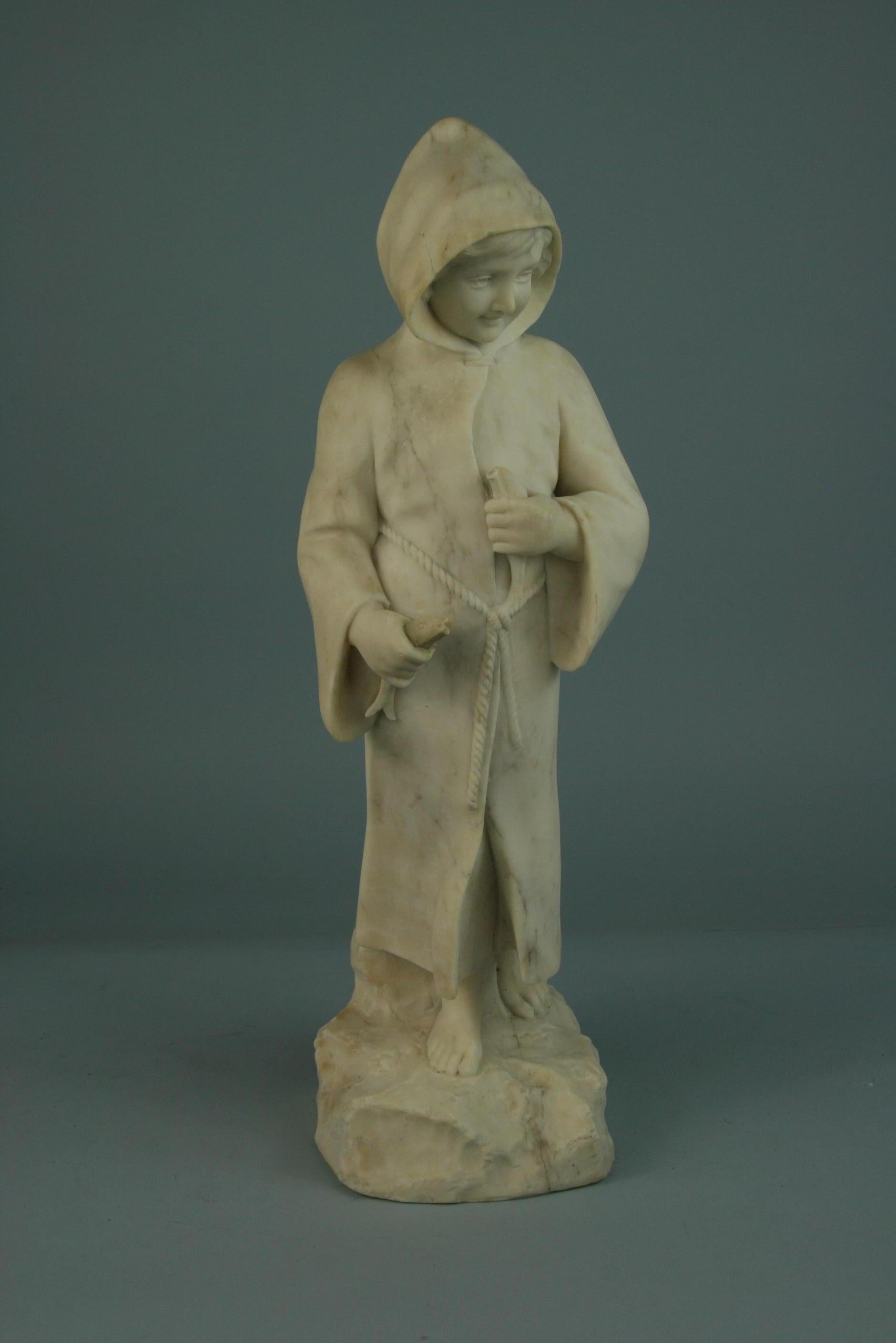 3-532 detailed marble sculpture of a robed boy holding 2 fishes.