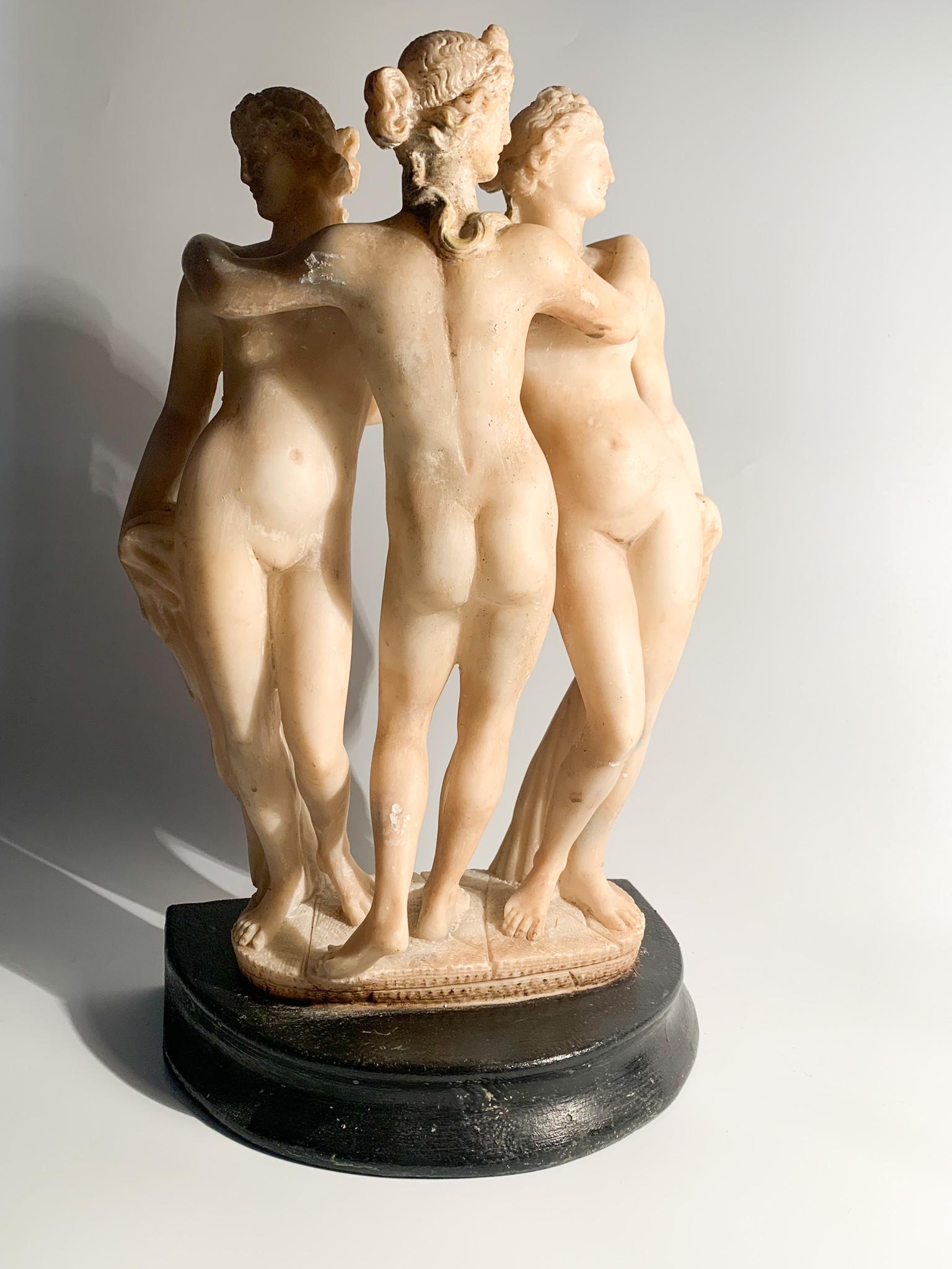 Marble sculpture and wooden base depicting the Three Graces, made in the 1940s

Measures : Ø cm 4 Ø cm 19 h cm 22.