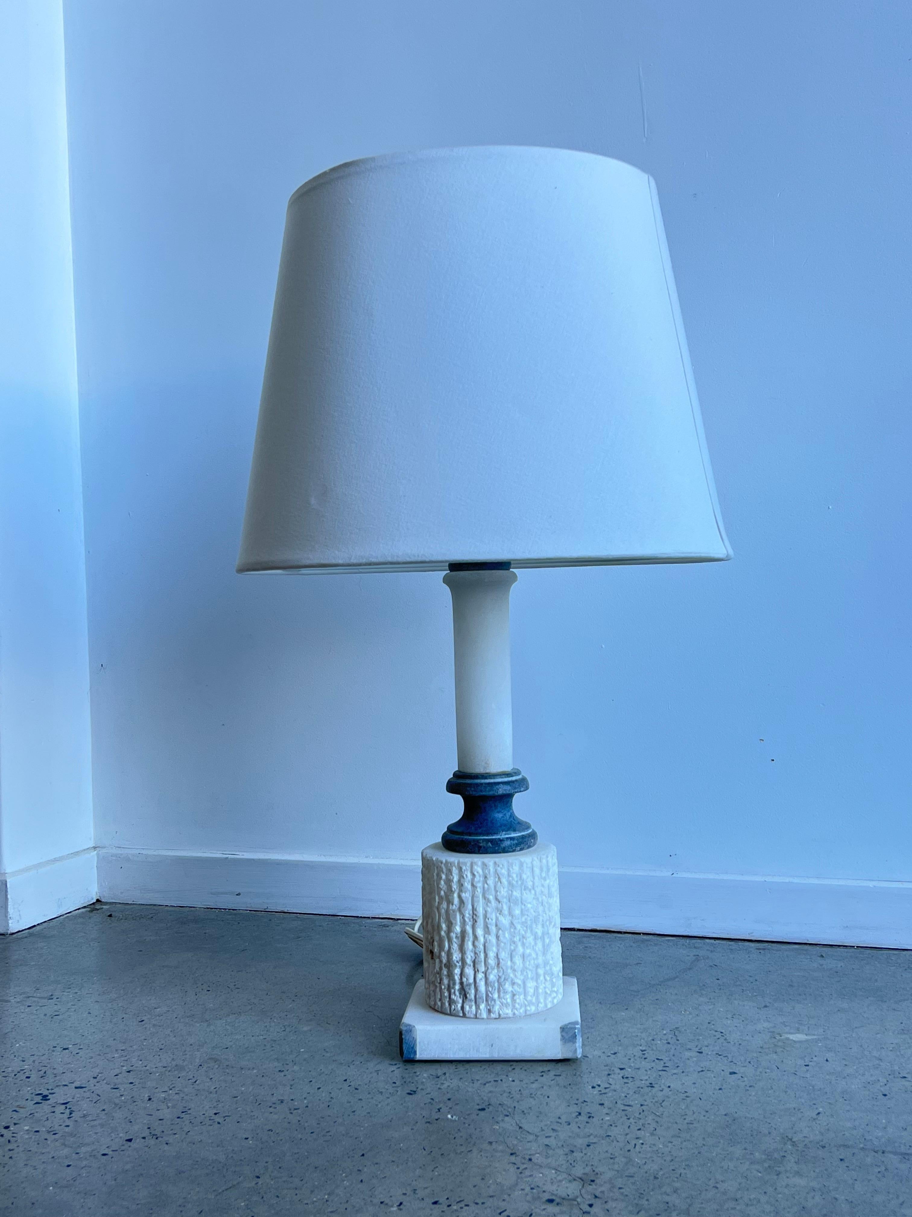 Italian white marble base table lamp 1950s.
Very stylish large table lamp or side lamp perfect for reading light.
Base it’s in different tones or marble dark and white.
We replaced the shade with a new round white cream colour shade.
 