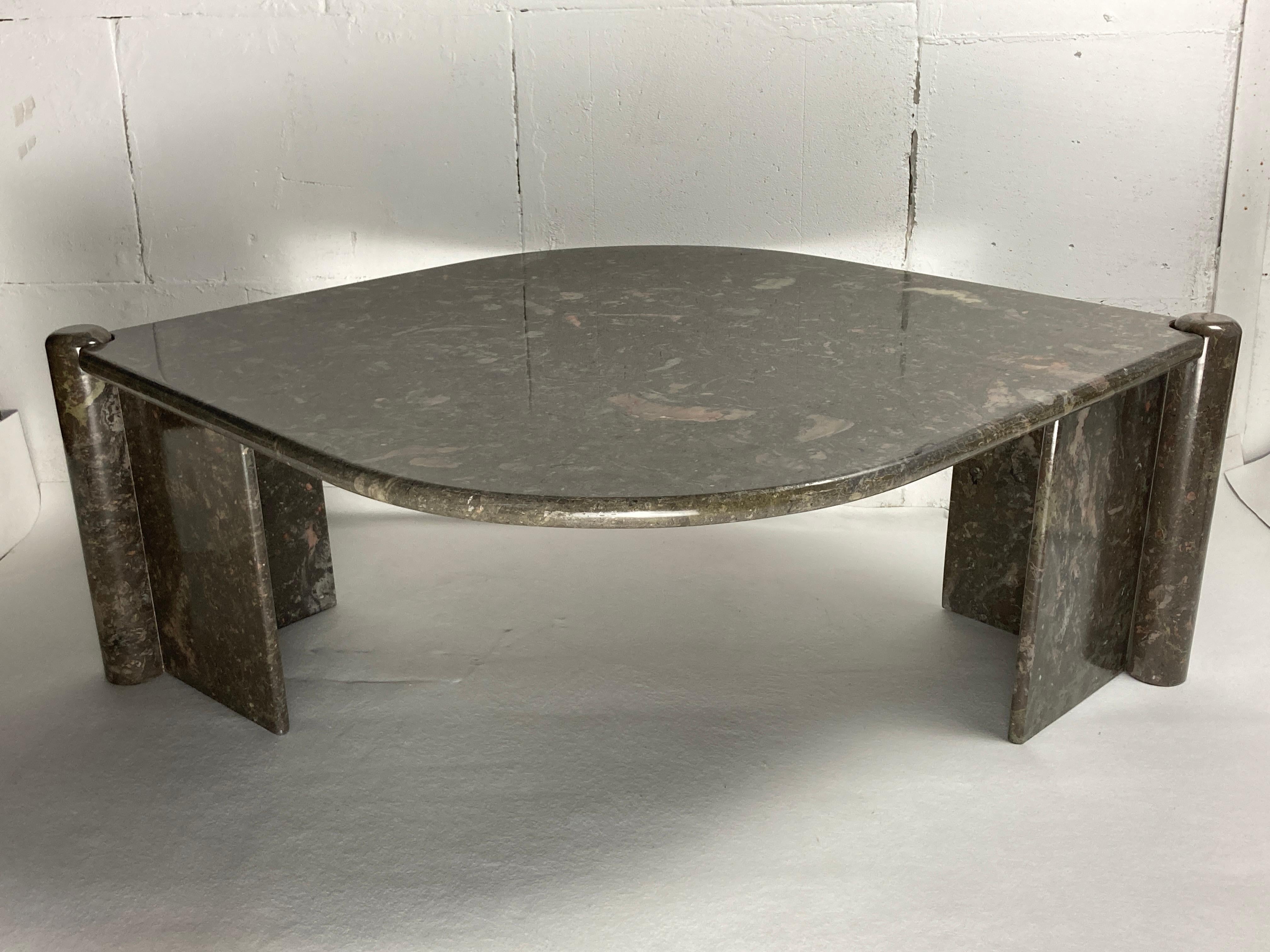 Absolutely stunning marble coffee table, somewhat in the style of Angelo Mangiarotti, Italy 1980s. The color is this subtle subdued green with lovely hints of old pink. The table is in good condition considering its age with only some very light
