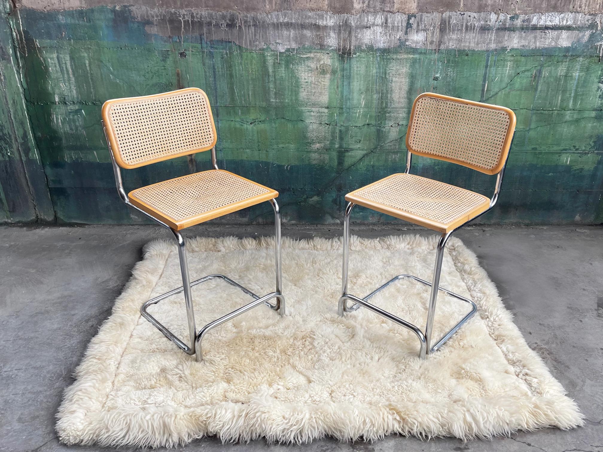 Very nice looking and strong Pair of very sturdy Marcel Breuer Italian Chrome and Birds eye woven cane seats and backs.  These also Feature the built-in footrests.

Very good vintage condition, and original vintage throughout.  There are no holes in
