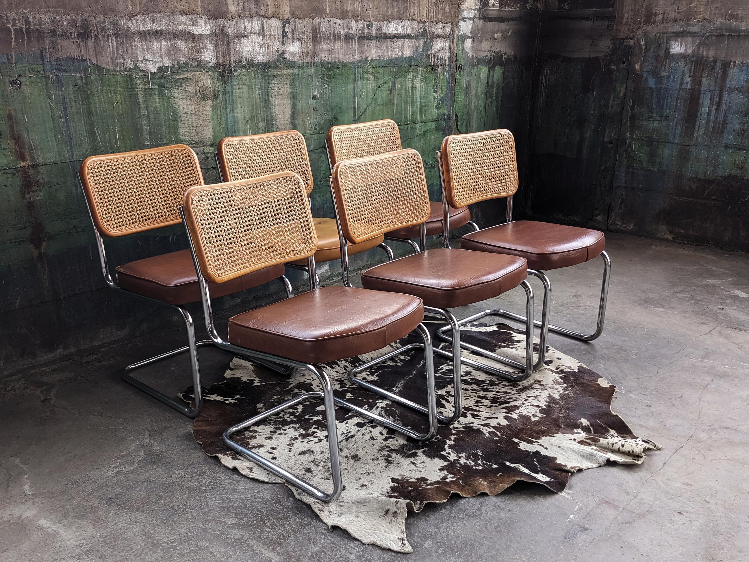 A beautiful set of 6 original Italian Breuer Cesca chairs with Wood framed seat and back with birds eye cane seat backs, cushioned seats and a chrome plated metal frame. This set is in very good vintage condition. Strong, comfortable set.

One seat