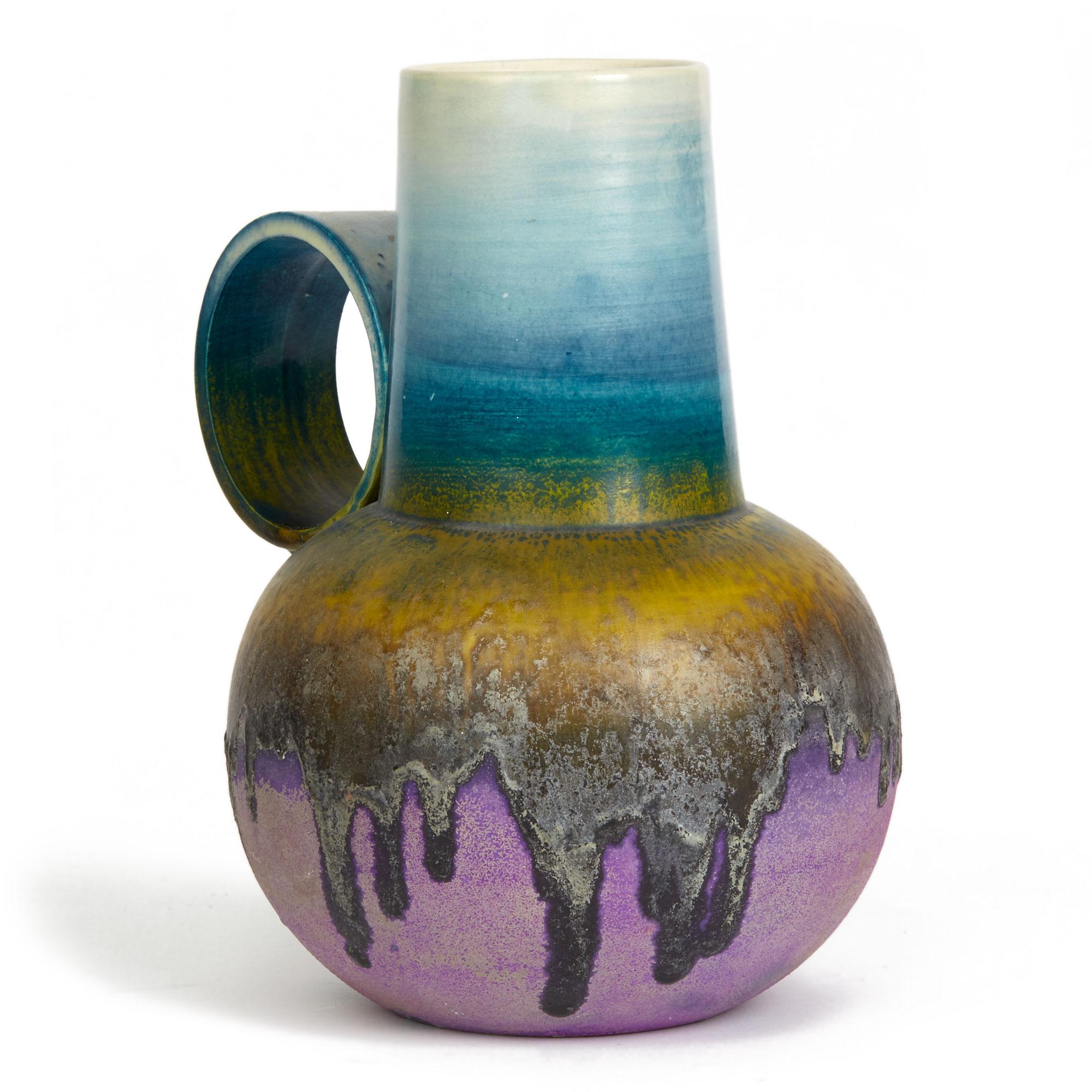 PLEASE NOTE: This piece is currently located in our Amsterdam office, please enquire for delivery times. 

A very stylish and unusual glazed ceramic handled vase by renowned Italian artist Marcello Fantoni (1915-2011). The rounded bottle shaped vase