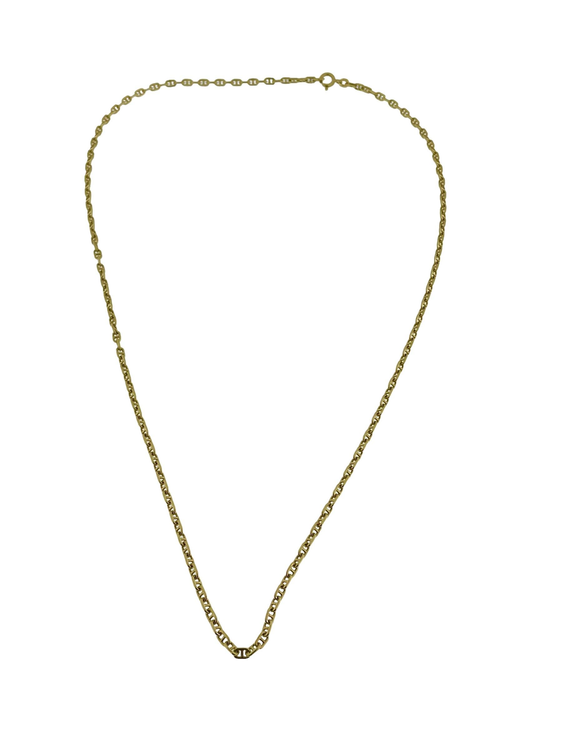 This Italian Mariner Link Chain crafted in radiant 18kt yellow gold by Balestra is a testament to both exquisite craftsmanship and timeless elegance. The Mariner link, characterized by its interlocking oval links with a bar through the center,
