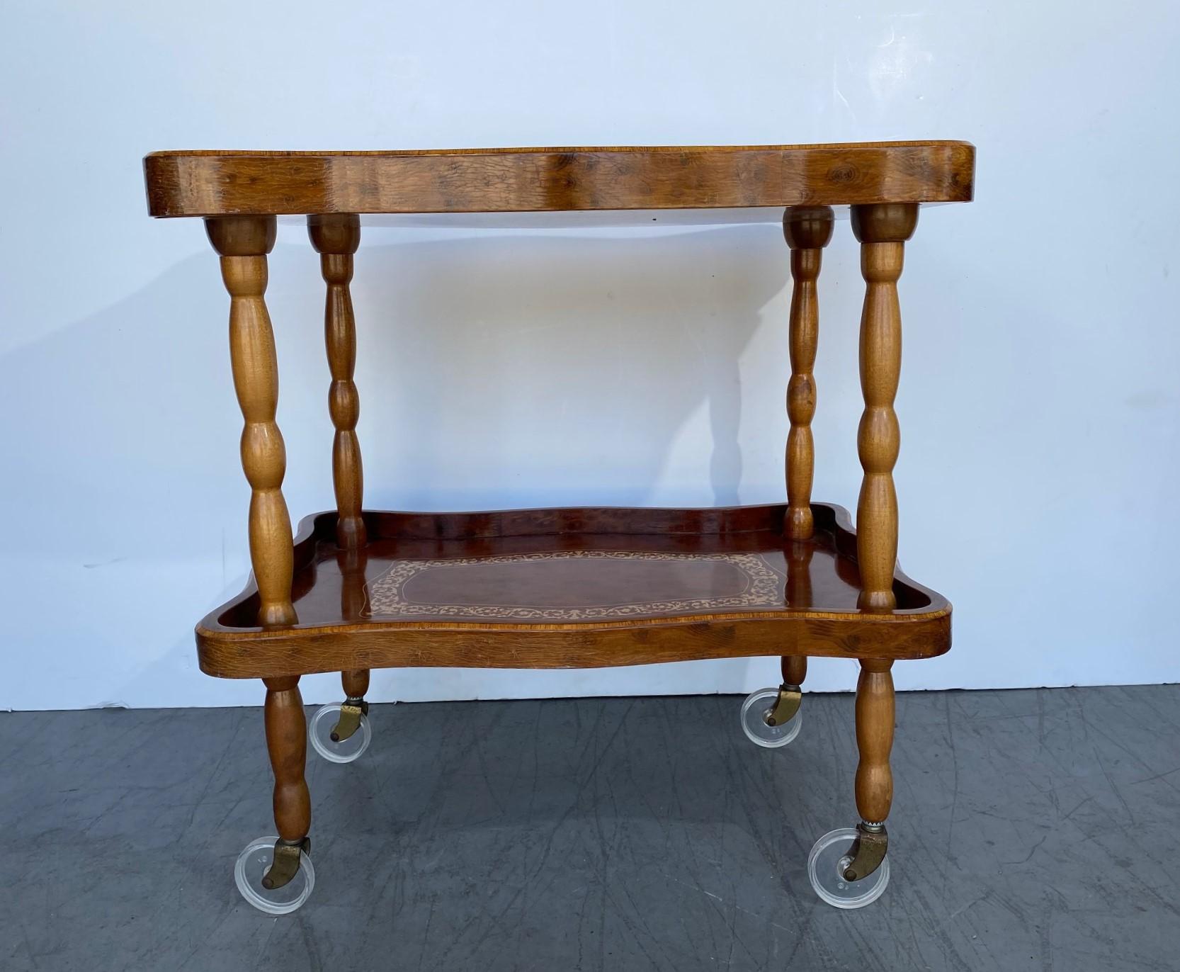 An Italian marquetry bar cart with a removable tray.
