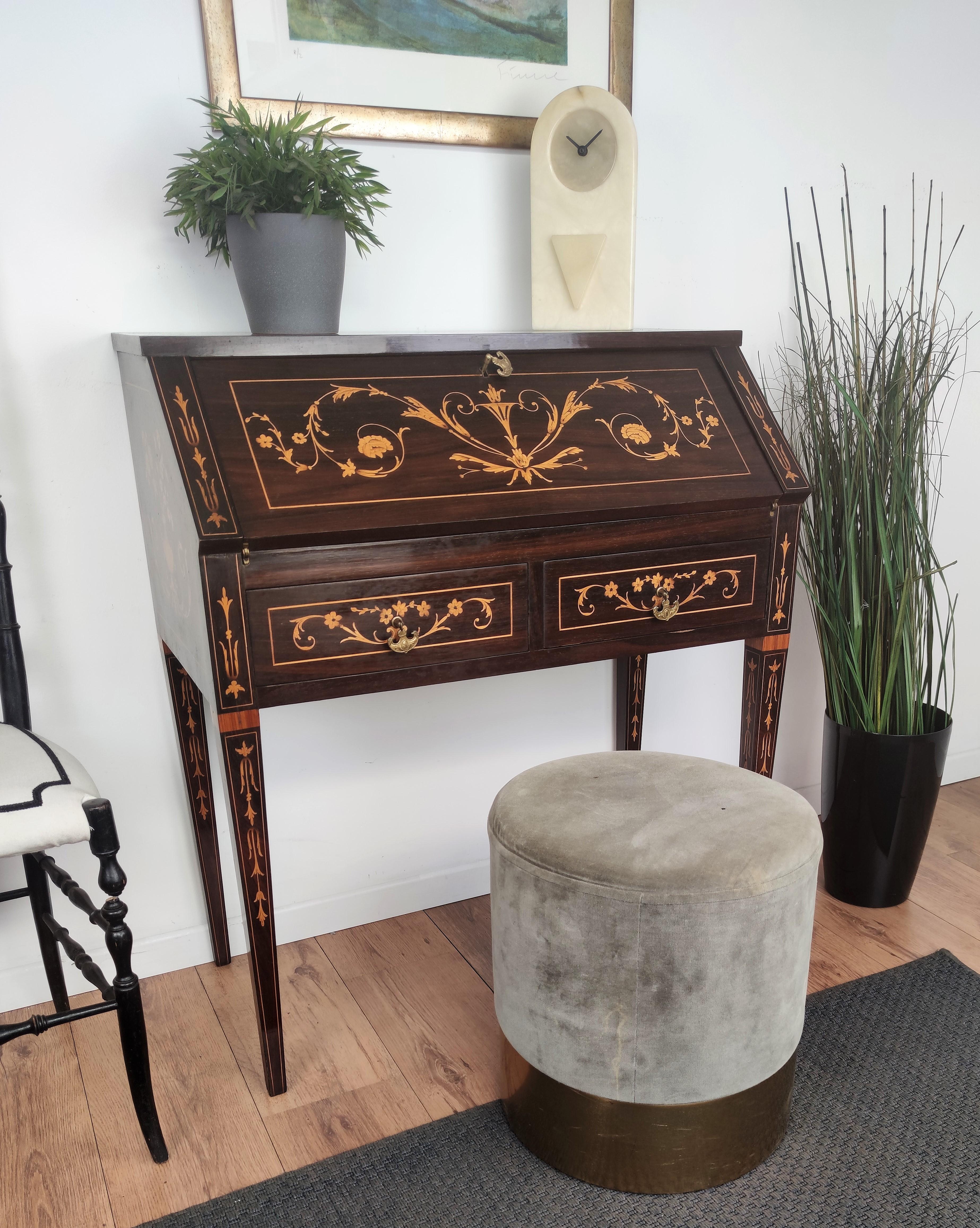 Very elegant Italian desk, writing table, with slant drop front, with the beautiful light and dark wood inlay decors in classic figures all around the piece. When closed we have 2 front drawers while when opened we find the writing area, two smaller