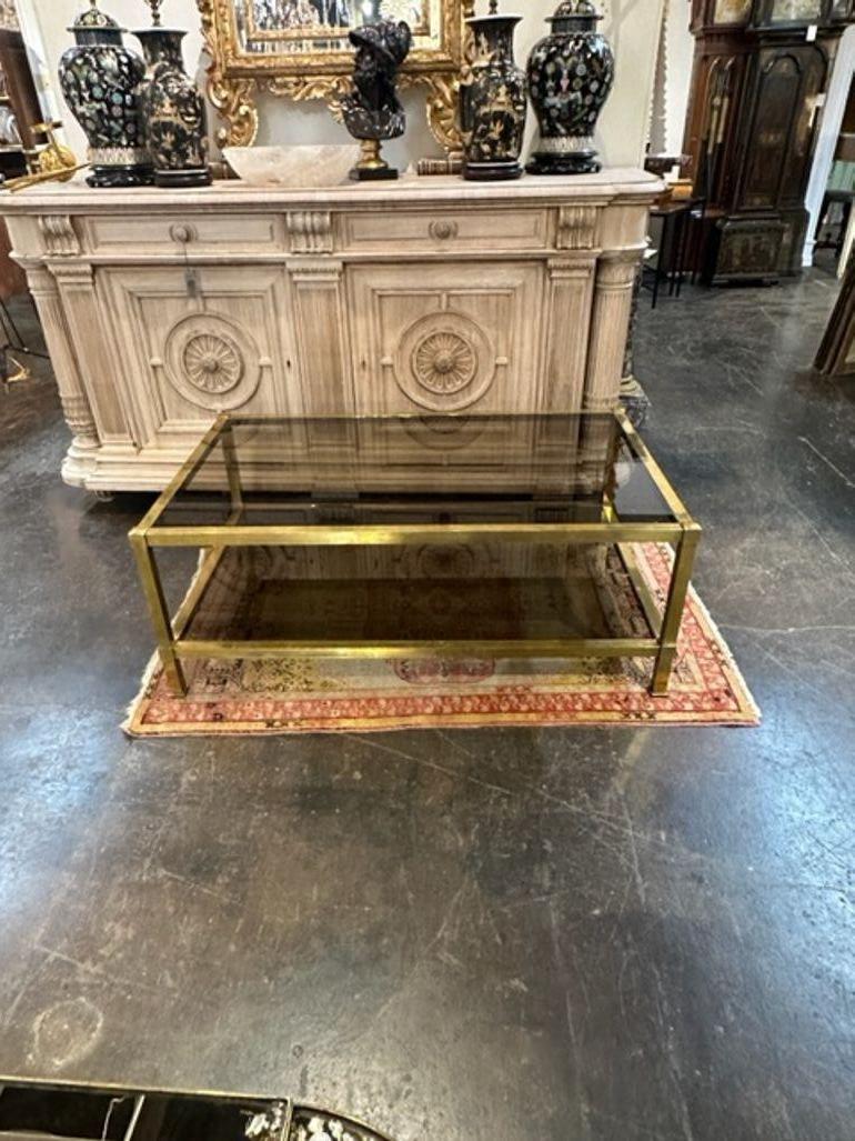 Very fine Italian MCM brass and smoke glass coffee table.  A quality piece that works in a variety of decors.  Lovely!!