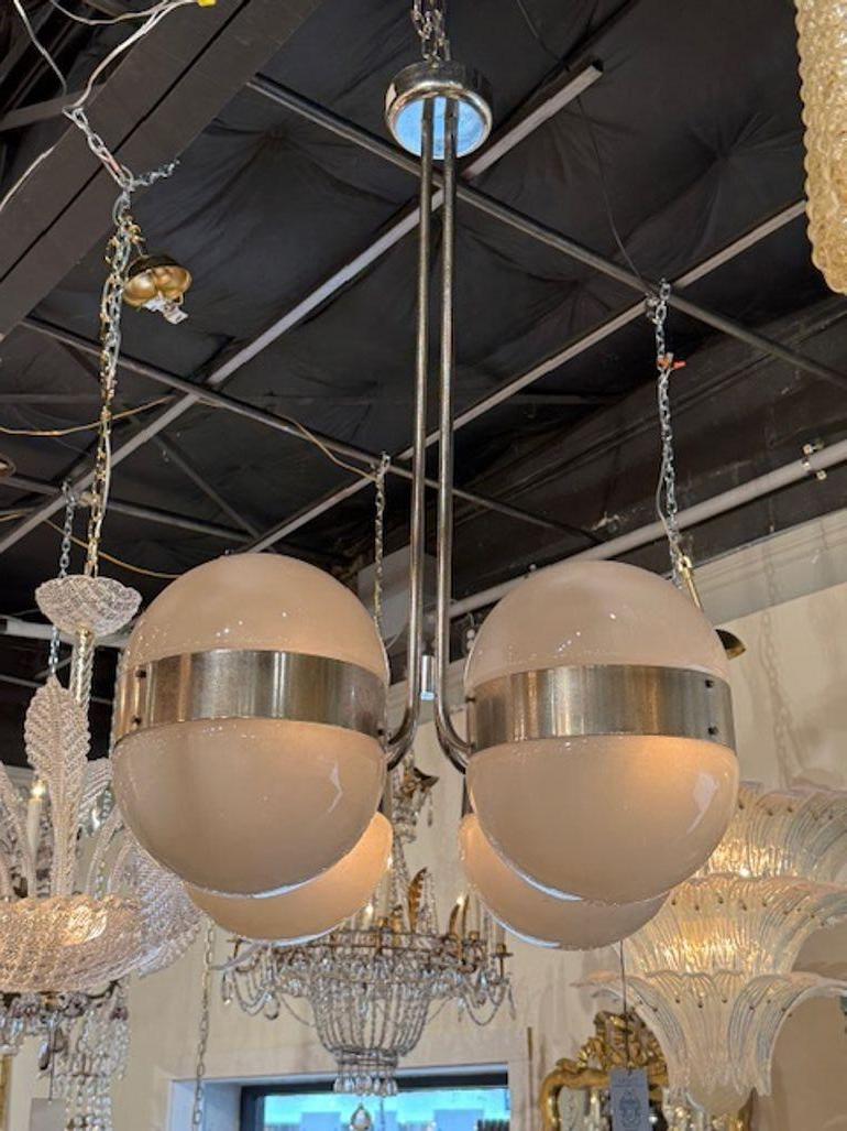 Italian MCM chromed brass and glass globe chandelier. Circa 1960. The chandelier has been professionally rewired, comes with matching chain and canopy. It is ready to hang! 41h x 28w