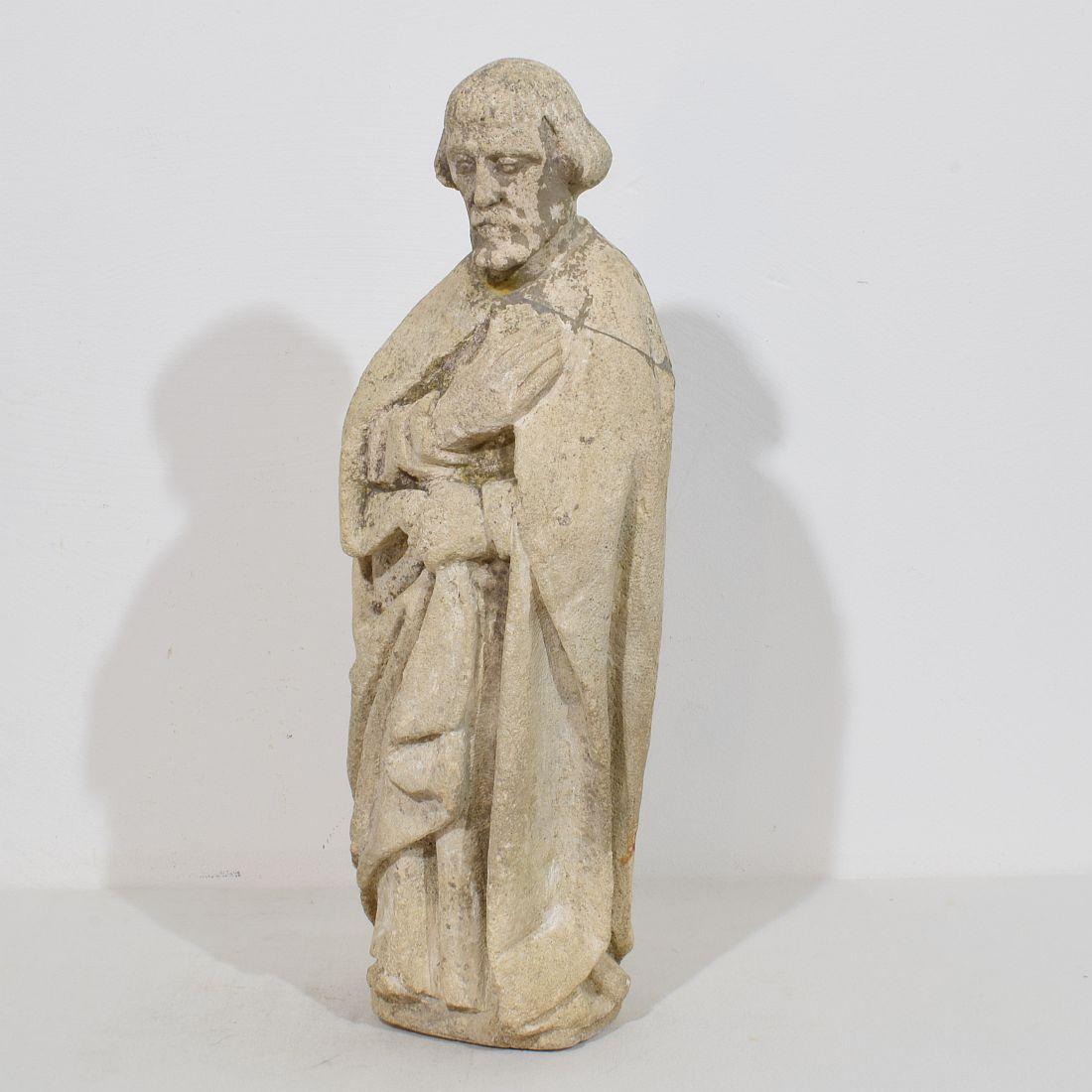 Beautiful  weathered hand carved stone medieval statue depicting a Saint . Italy 16th century. Weathered, small losses and old repair.
H:51cm  W:18cm D:13cm 