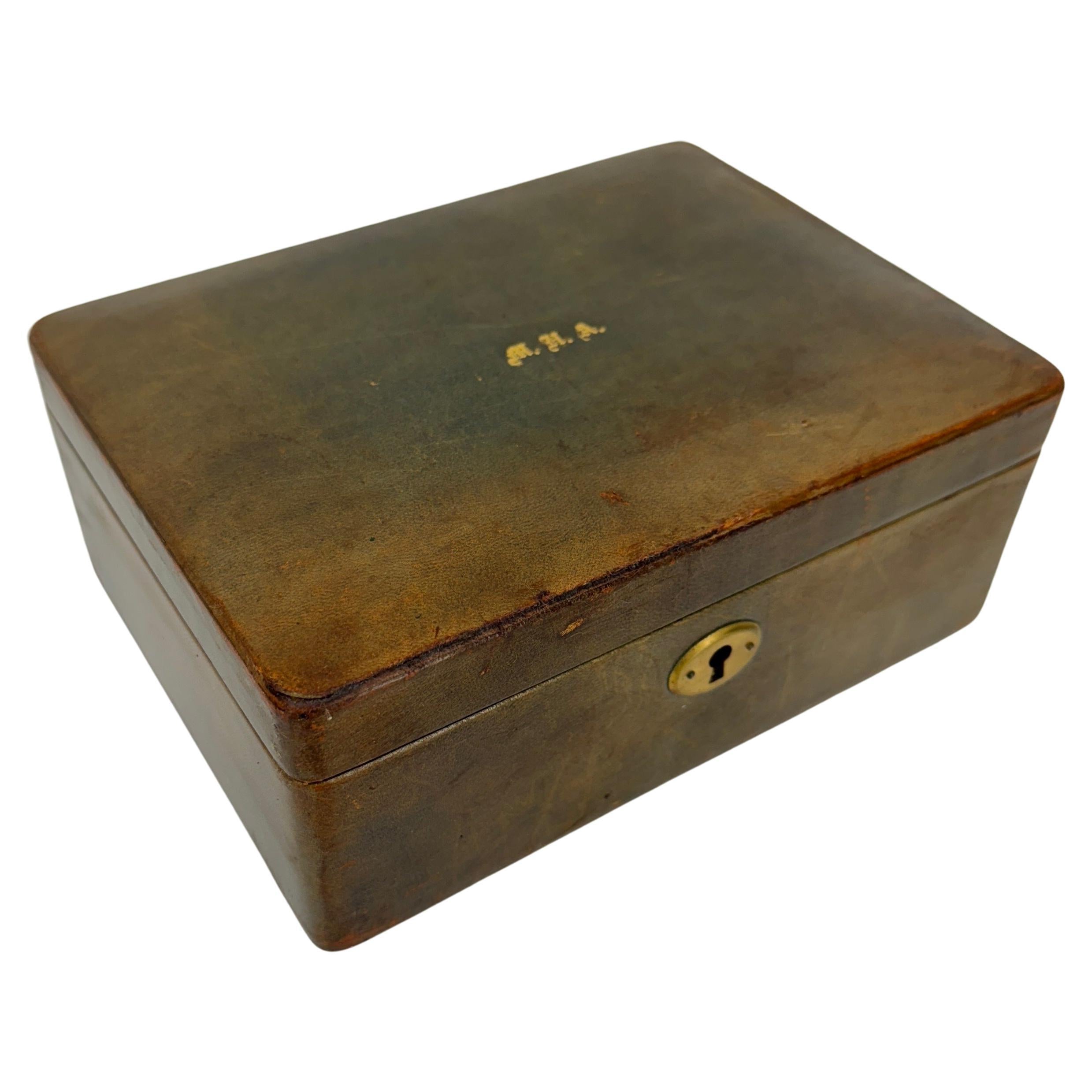 Mid-Size Leather Jewelry Box, Italy Circa 1950's

Feminine as well as charming mid-size leather box hand crafted in brown leather and gold embossed monogram. Monogram letters are M.H.A. The interior features green moire fabric. Marked Rumpp on the