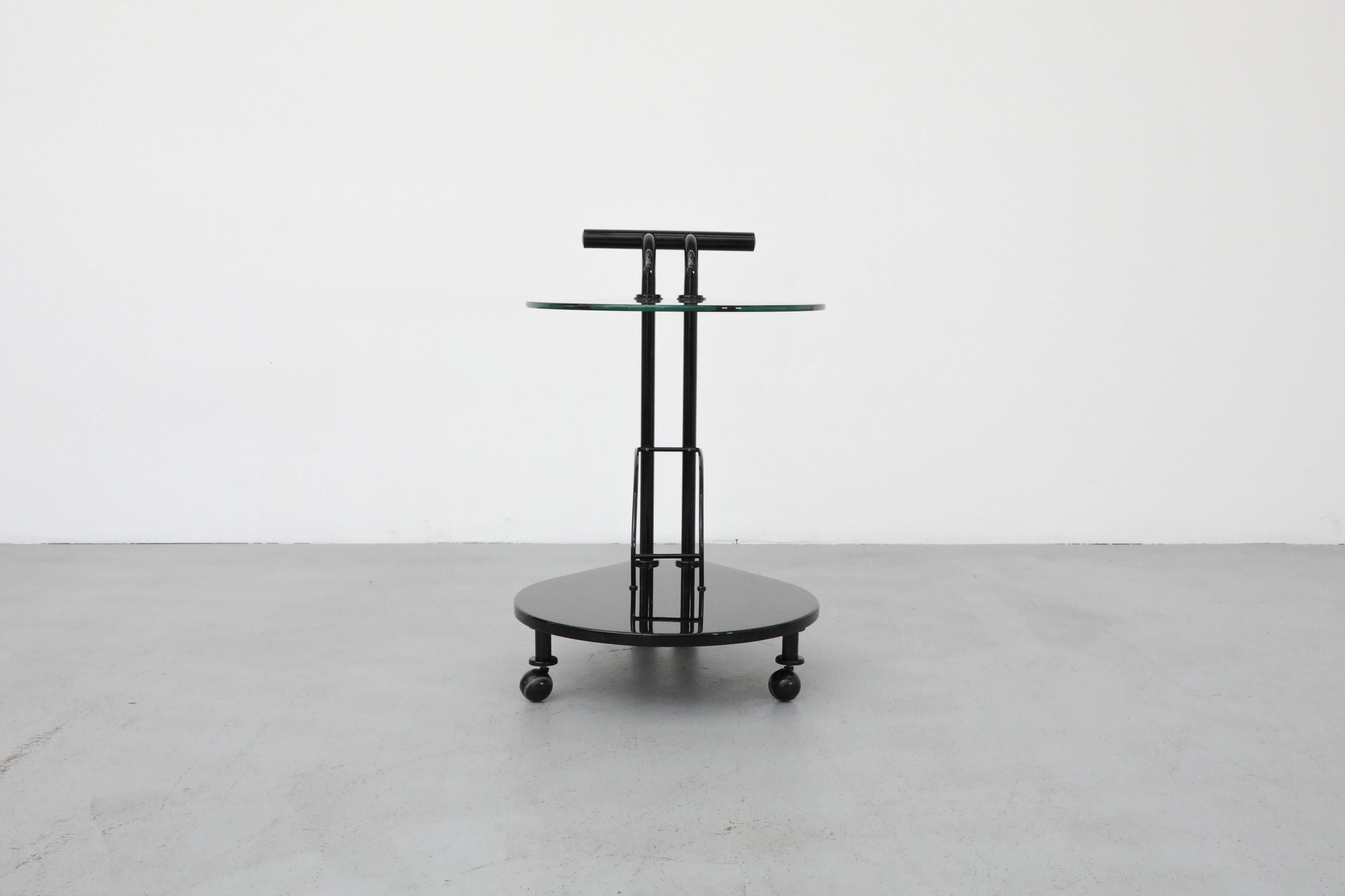 Post-Modern Italian Memphis Style Two Tiered Rolling Bar Cart with Black Frame and Glass Top For Sale