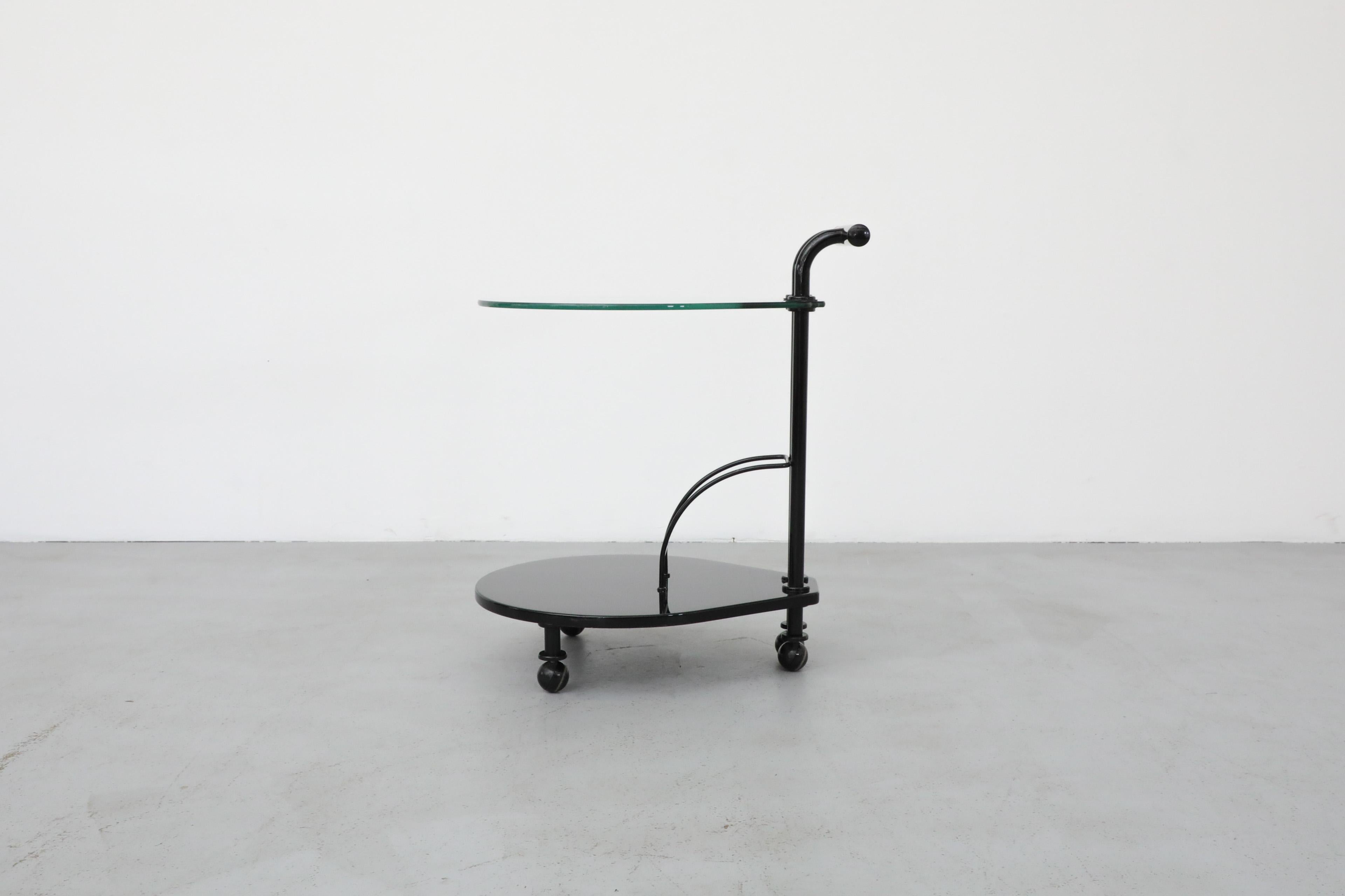 Italian Memphis Style Two Tiered Rolling Bar Cart with Black Frame and Glass Top In Good Condition For Sale In Los Angeles, CA