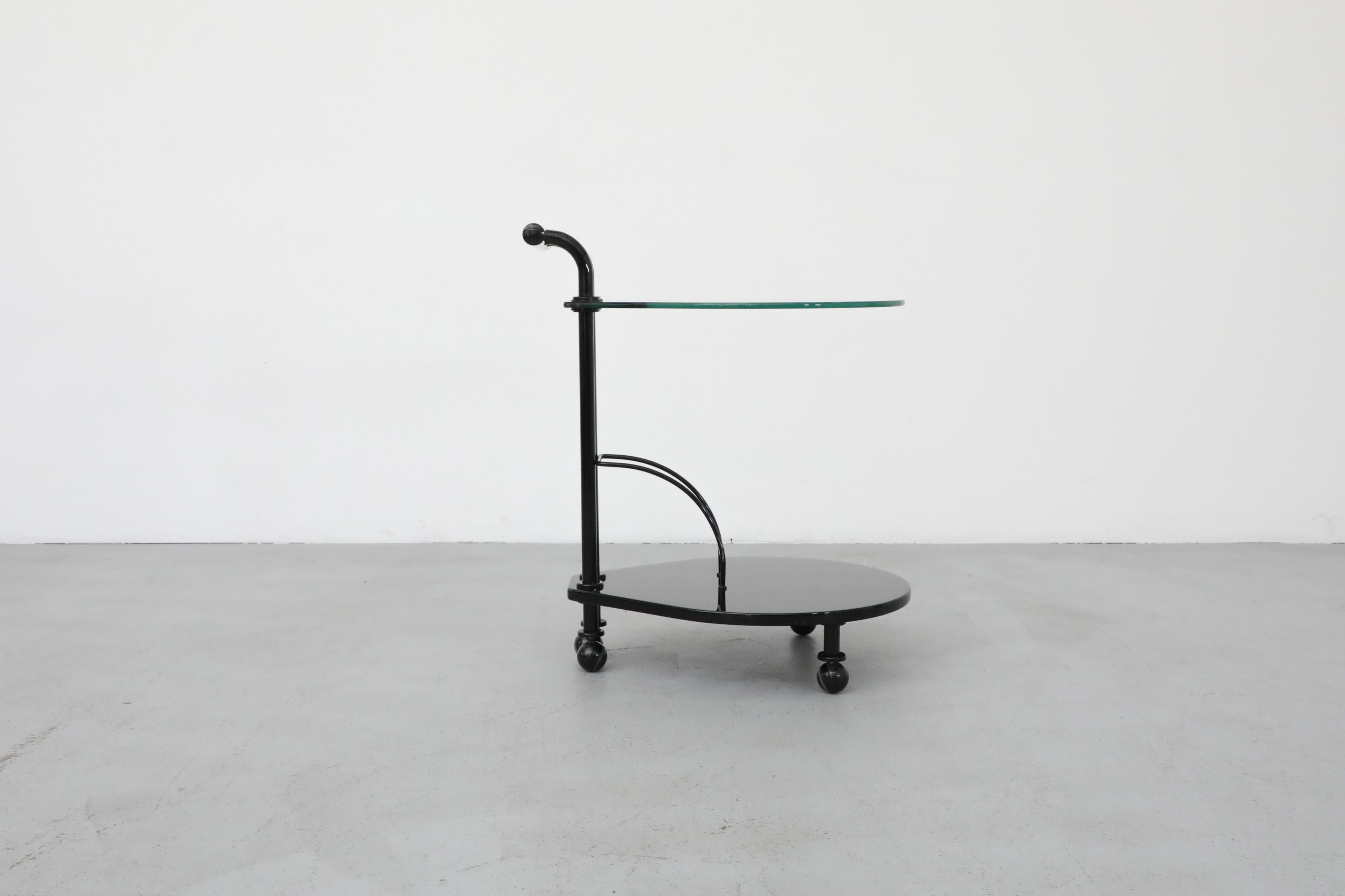 Italian Memphis Style Two Tiered Rolling Bar Cart with Black Frame and Glass Top For Sale 1