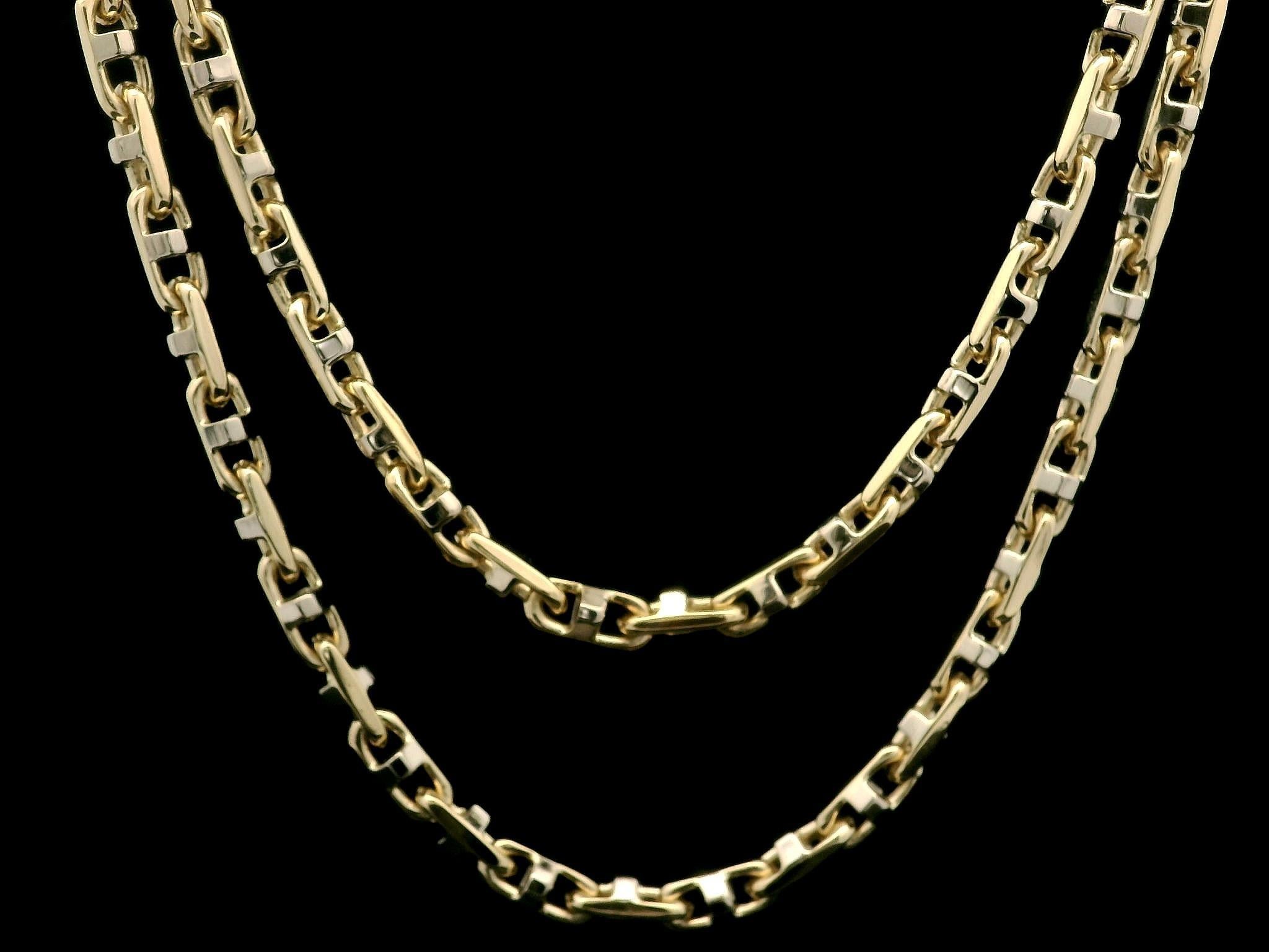 Material: Solid 14k Yellow Gold w/ White Gold Accents
Weight: 32.67 Grams
Chain Type: Unique Link
Length: 22 Inches 
Clasp: Lobster Claw
Width & Thickness: 3.6mm
Condition: Excellent condition!
Stock Number: MK-170185899
