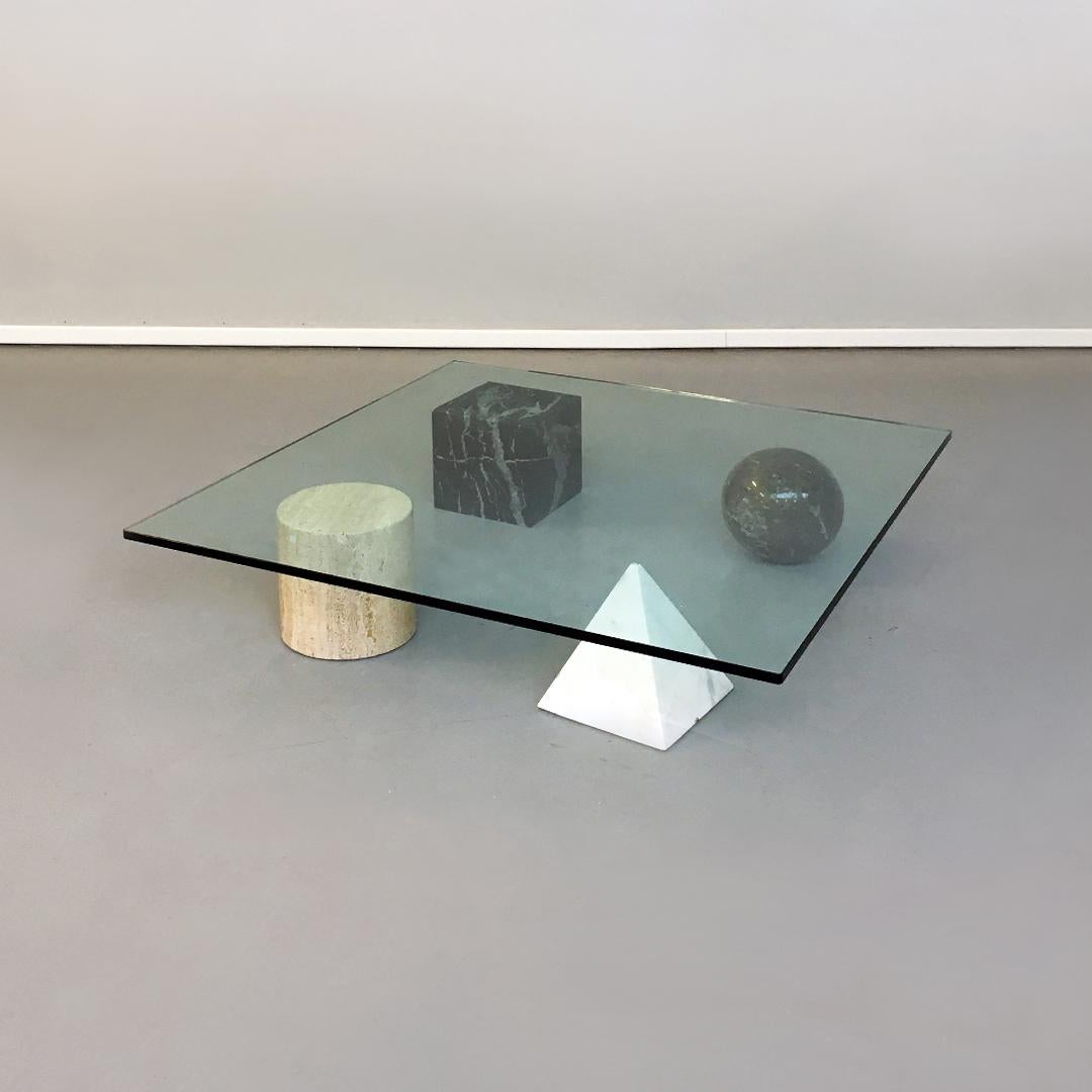 Italian Metafora coffee table by Massimo e Lella Vignelli for Casigliani, 1979
Metafora coffee table with four legs of different stones (marquinia, granite, white marble and travertine) and shapes and top in 2cm thick aquamarine green