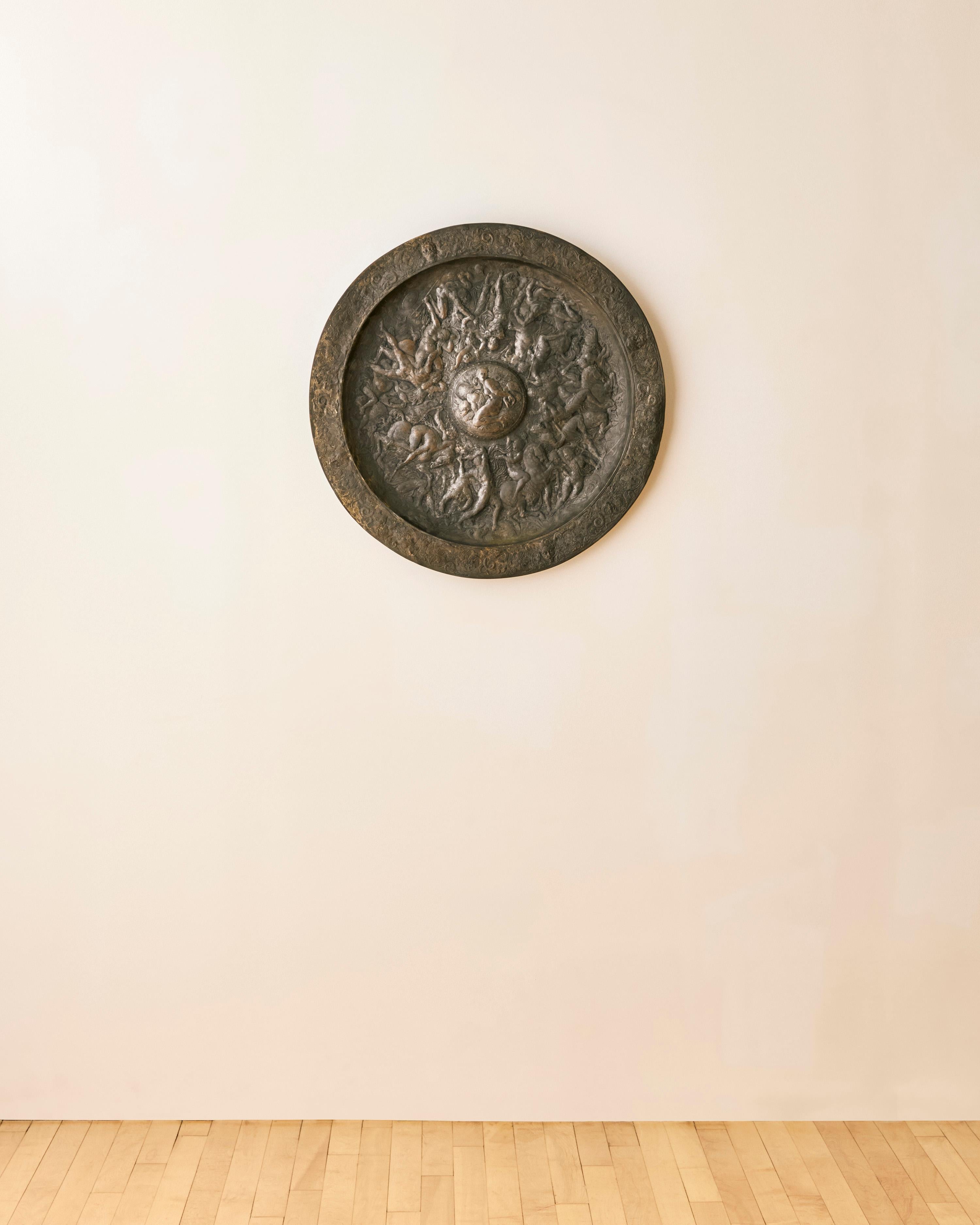 Italian metal relief charger in the manner of Eugenio Bellosio depicting allegorical figures in battle scenes c. 1900. 