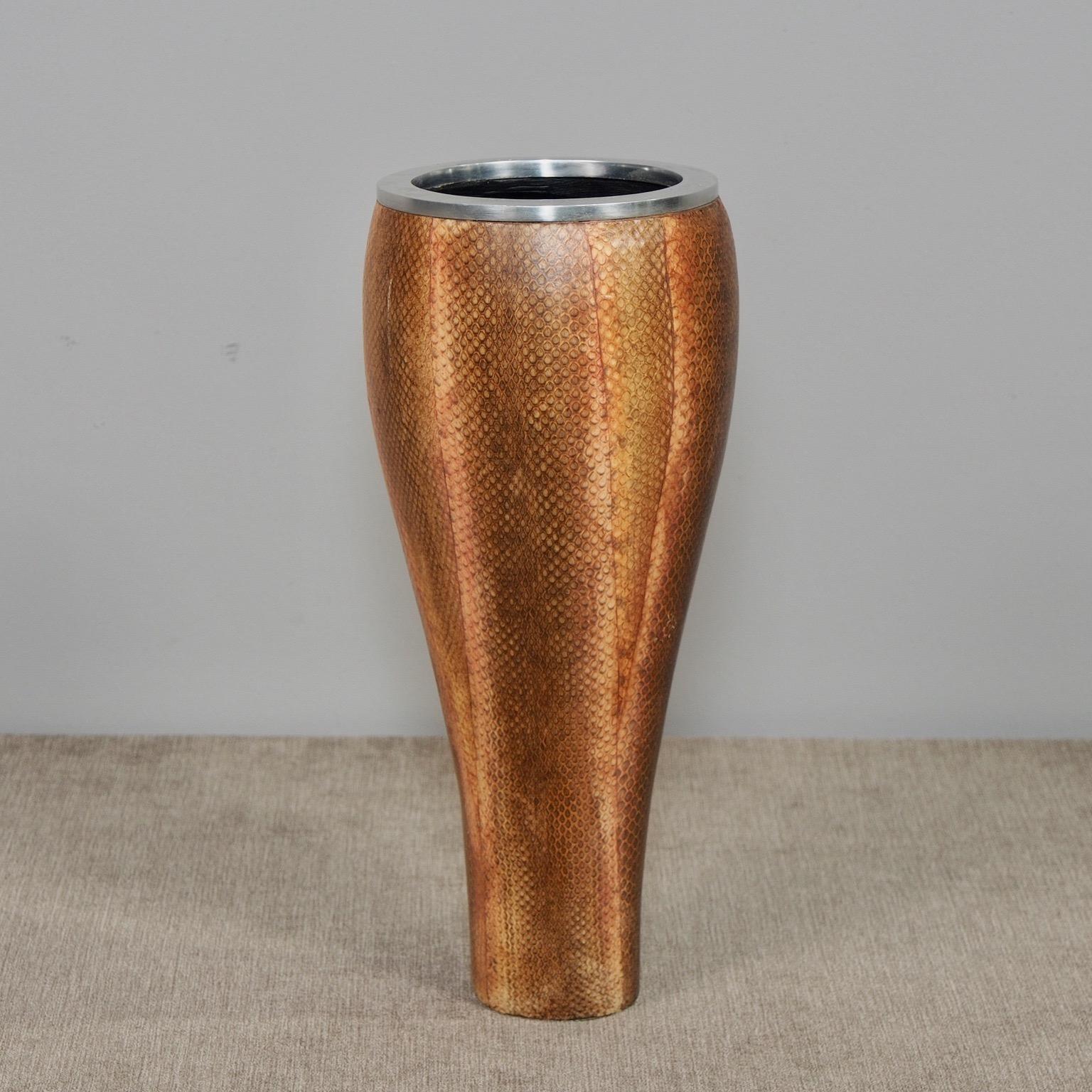 New Italian vase features a silver tone metal base that is narrower on bottom and wider at top. Real snakeskin surface has been hand painted. Unknown maker. Other similar pieces in various forms and colors also available at time of this posting.