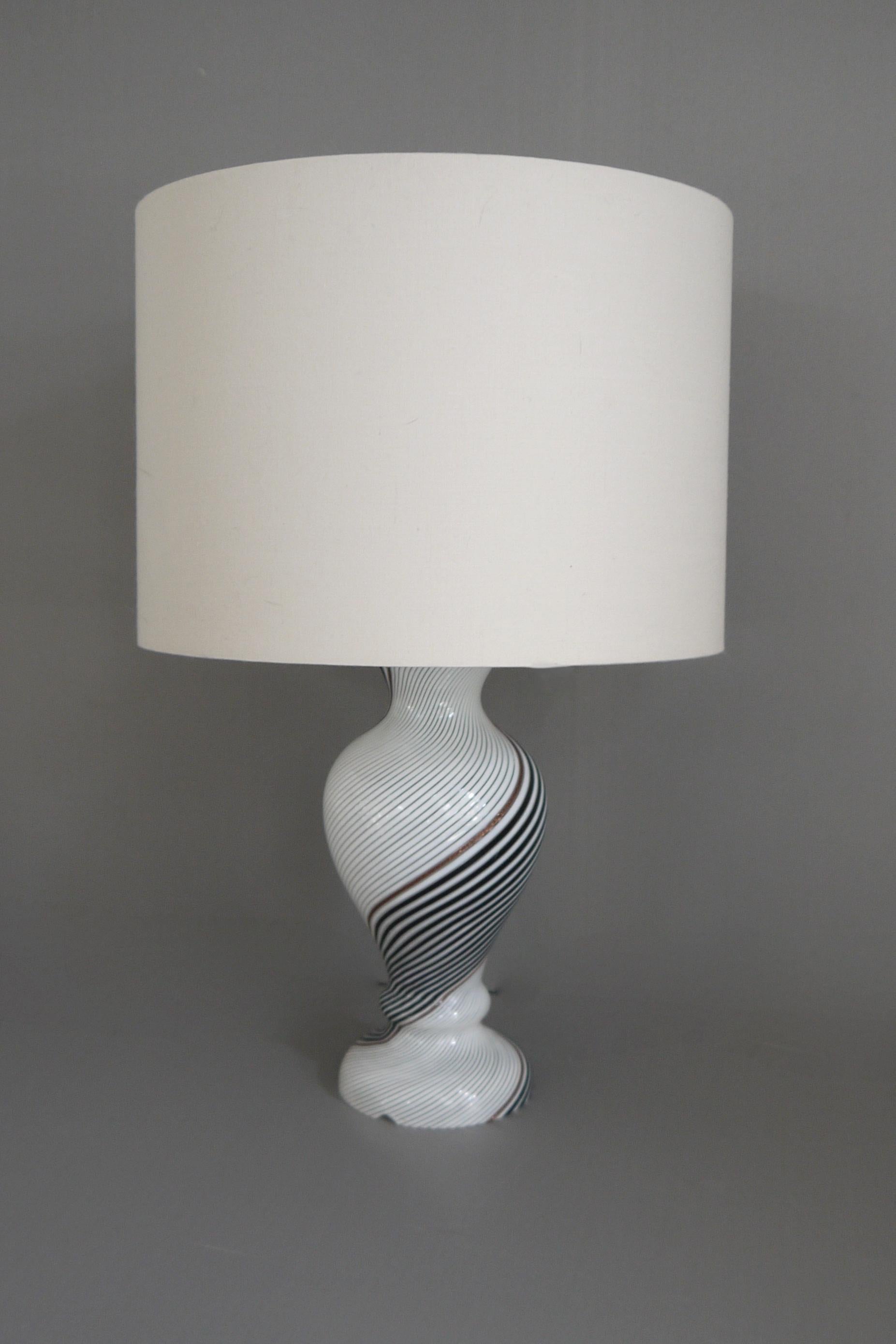 A Dino Martens Mezza Filigrana lamp base for Aureliano Toso, 1957. Made using the Bianca Nera technique blown white and black mezza filigrana with flashes of aventurine. Produced in 1957 when Martens was working with Aurelian Toso. There is a cable