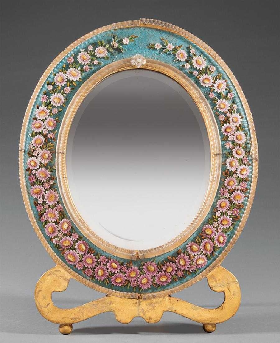 Beautifully detailed Italian micro mosaic oval dressing mirror on a scrolled gilt wood base.
Early 20th century.
Meticulous attention was given to the crafting of the micro mosaic flowers. Can be used as a mirror on the table and could be mounted