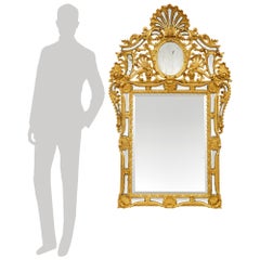 Specchio in legno dorato della metà del XVIII secolo, periodo Luigi XIV.